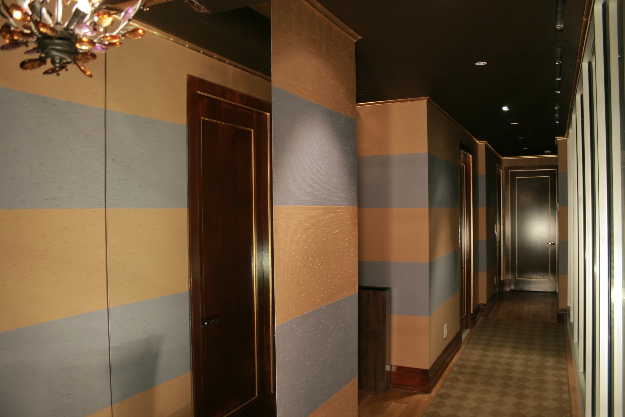 Installation of striped wallcovering in lower east side apartment