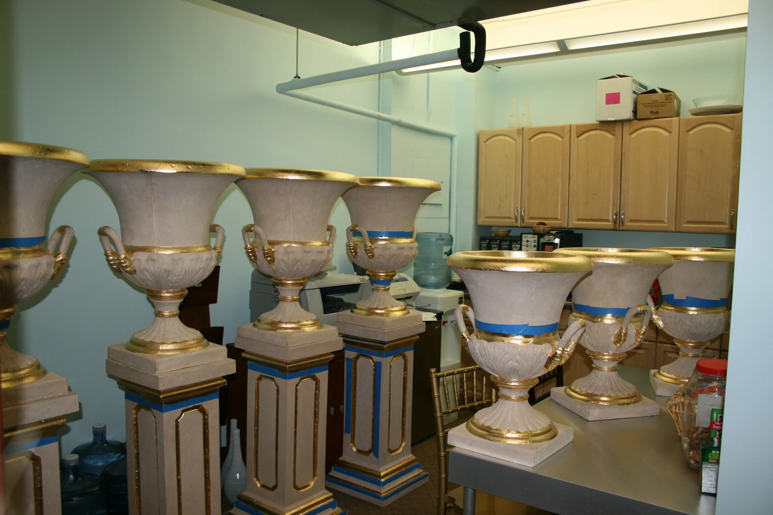 Gilded gold leaf details for decorative urns