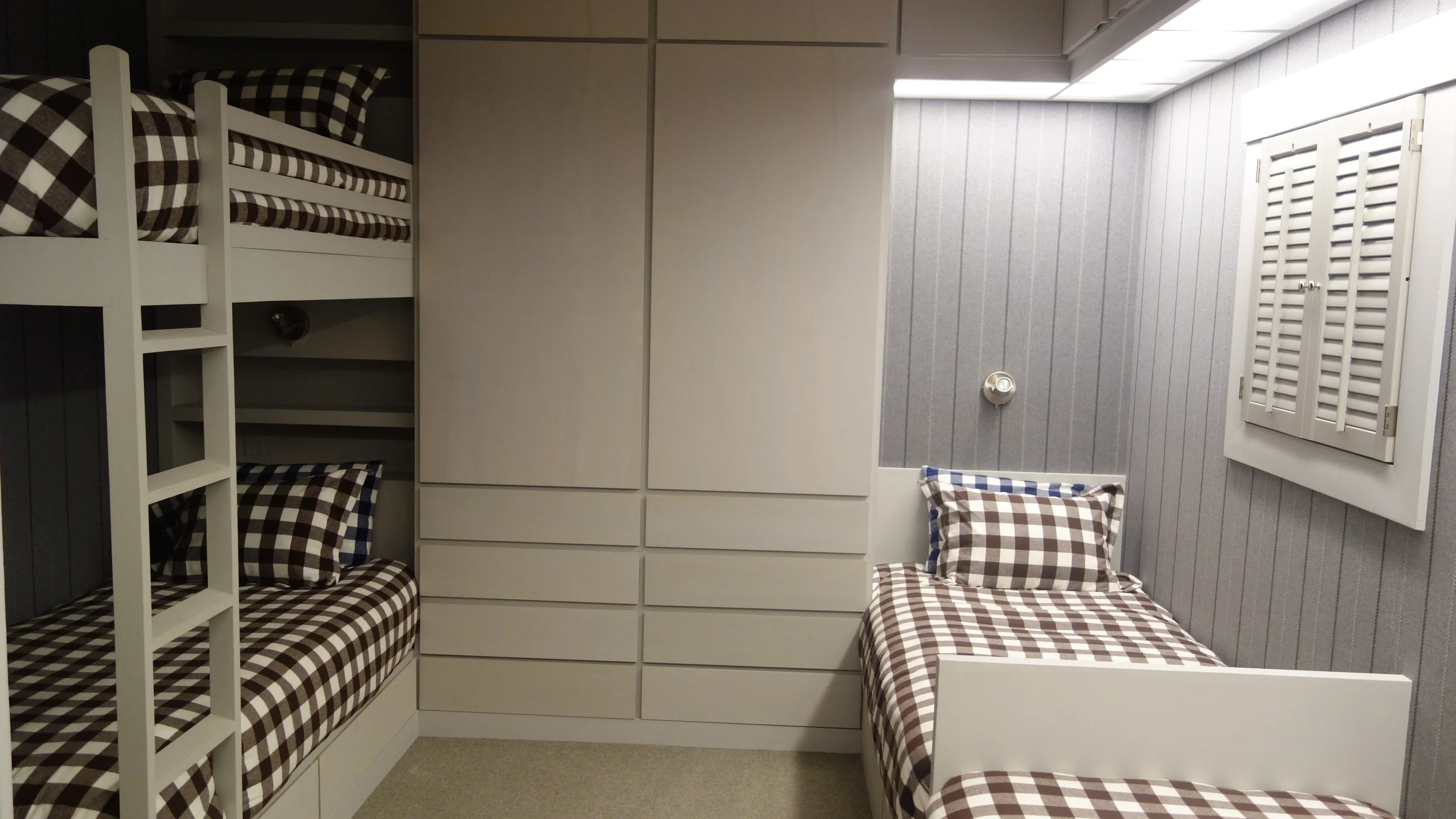 Custom bunk beds and closet space for kids room in Ski home
