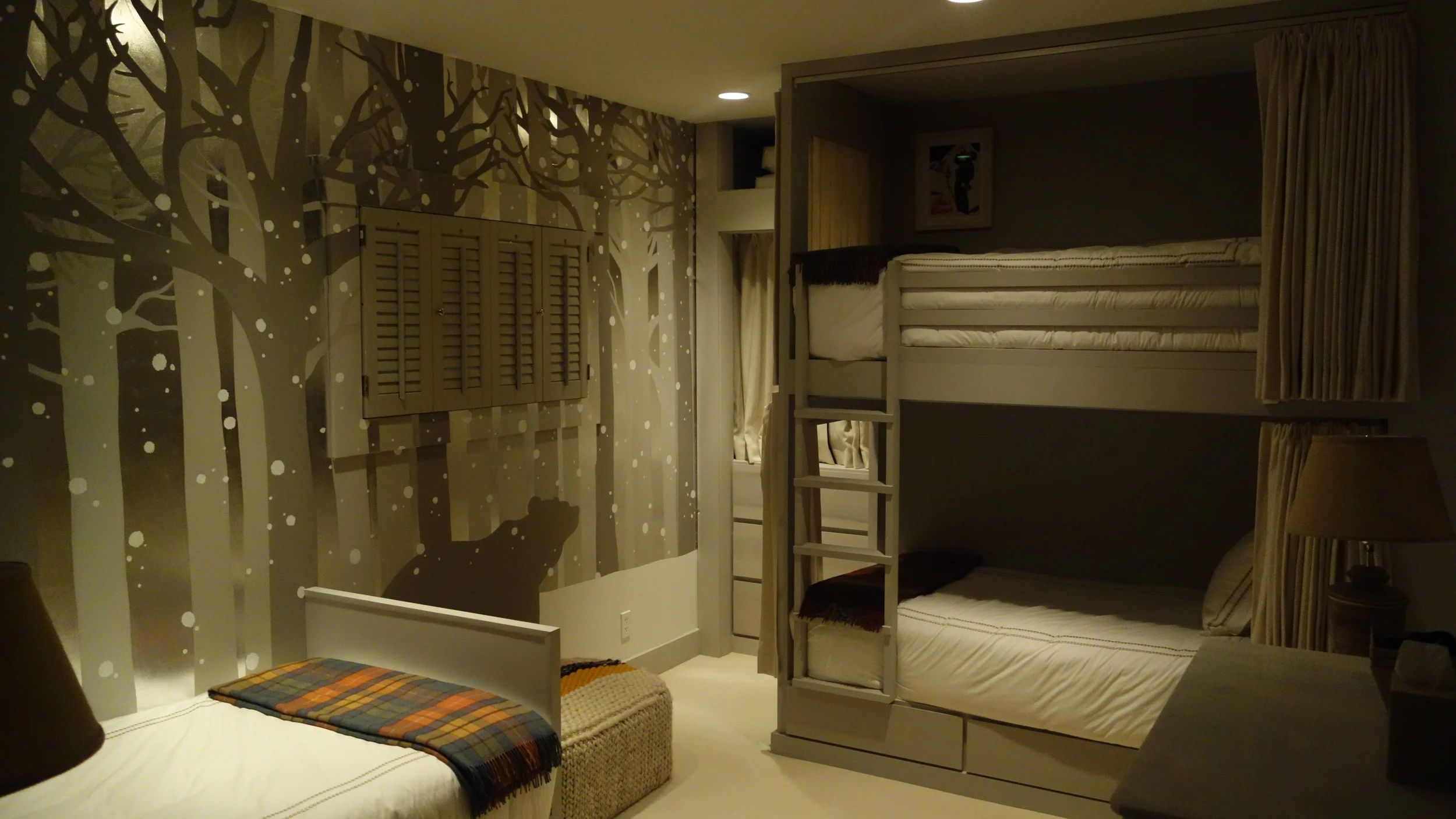 Custom bunk beds with curtains and shelving