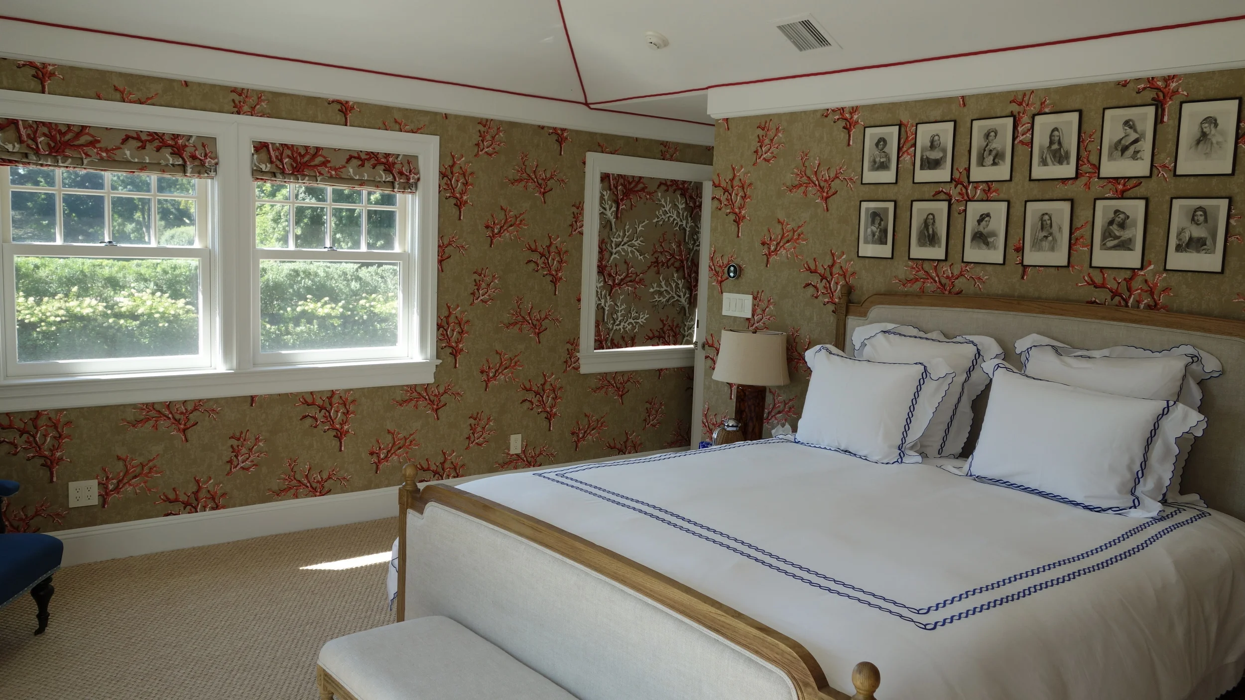 Wallpaper installation with ribbon detail on ceiling