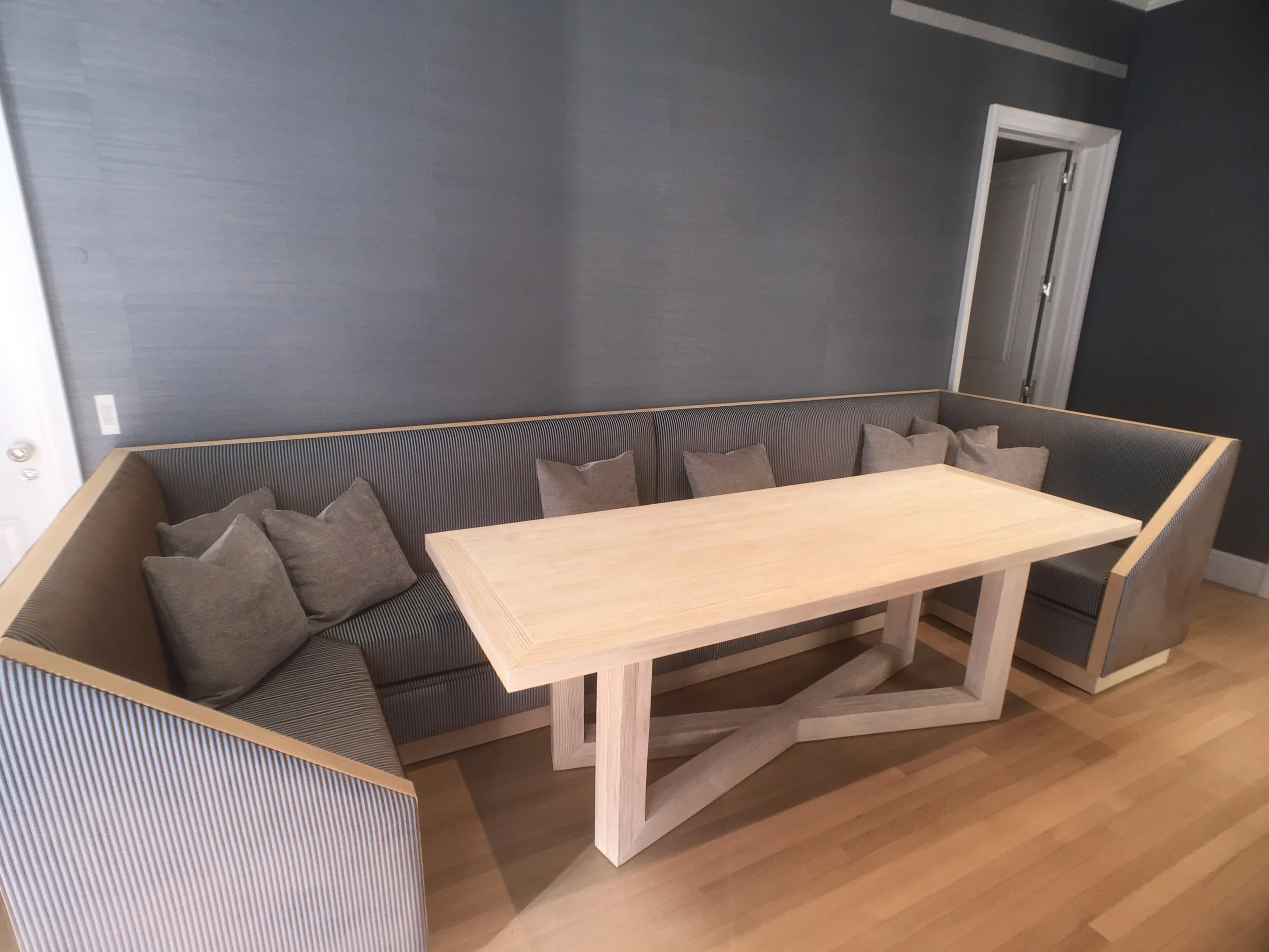 custom banquette seating area and breakfast table in 5th ave apartment