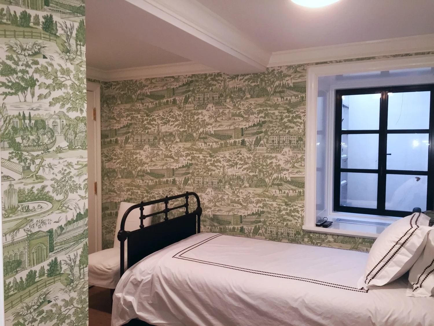 Wallpaper installation in guest bedroom