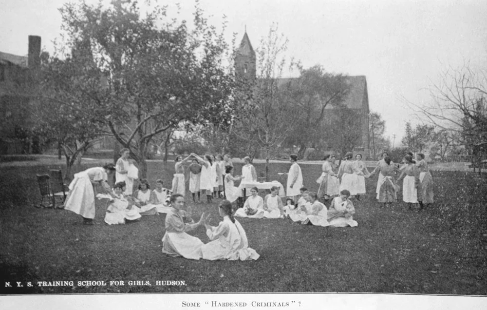 From a photograph of the NYS Training School for Girls, Hudson, NY in the institution's annual reports. The caption reads: "Some 'Hardened Criminals'?"