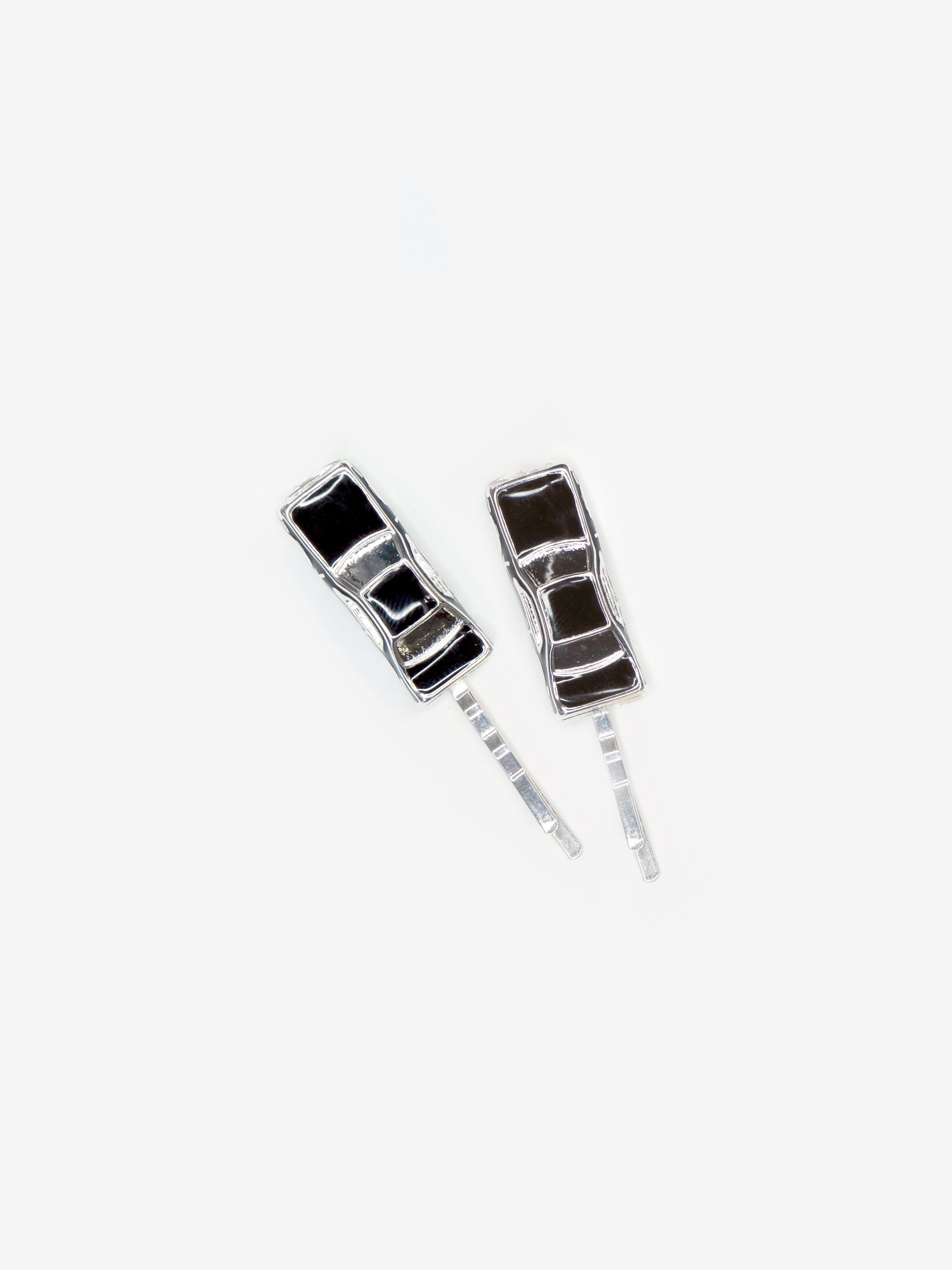 Pair of two traffic jam hairpins with little black and silver cars on a pin shown on white