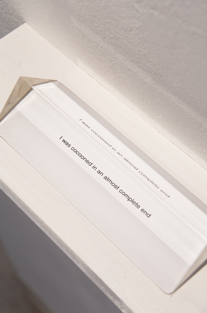 Mara Duvra A Complete End 2015 4 x 12 inches glass prism, pigment print, wood shelf
