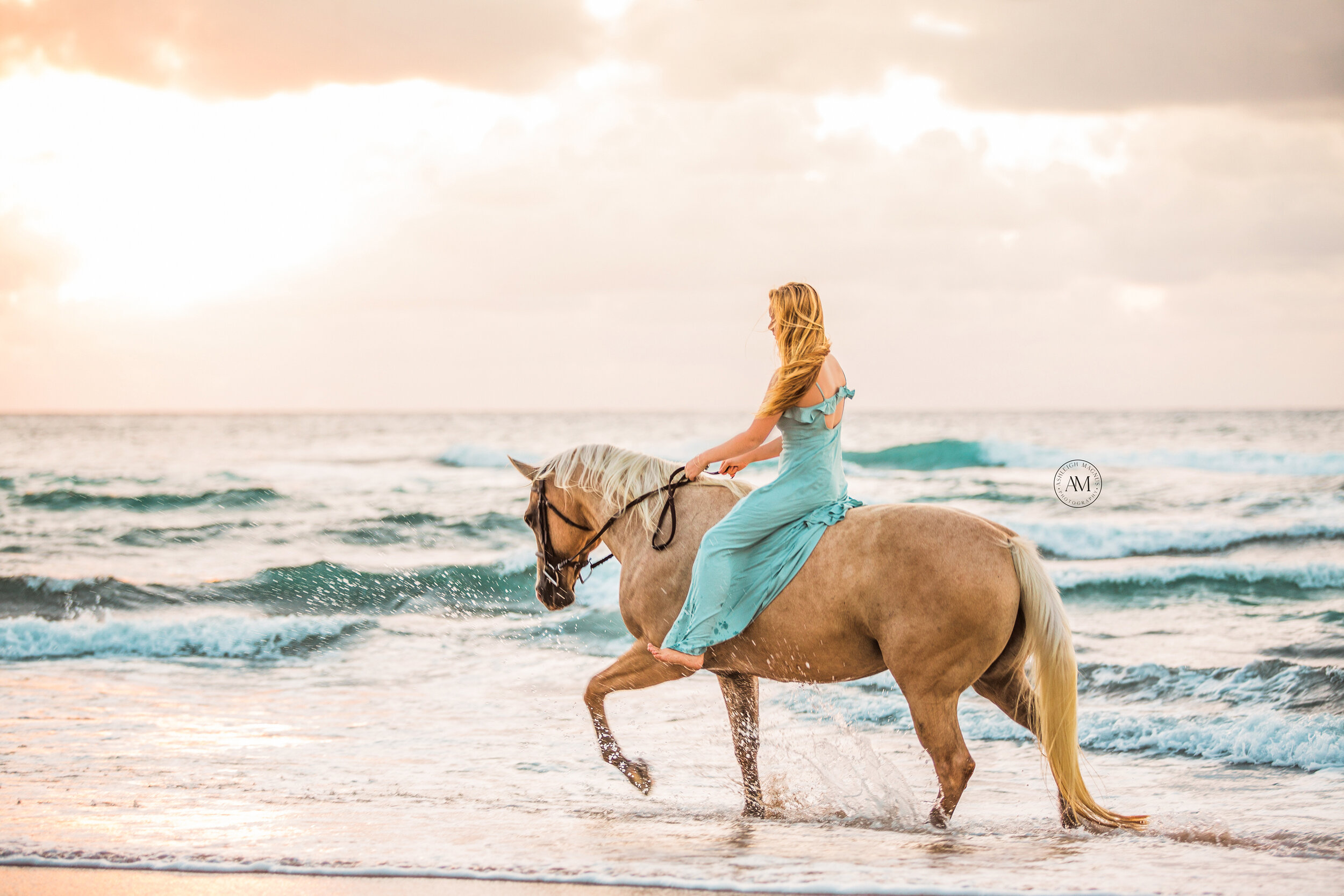 Girl riding on her horse in the ocean with a dress