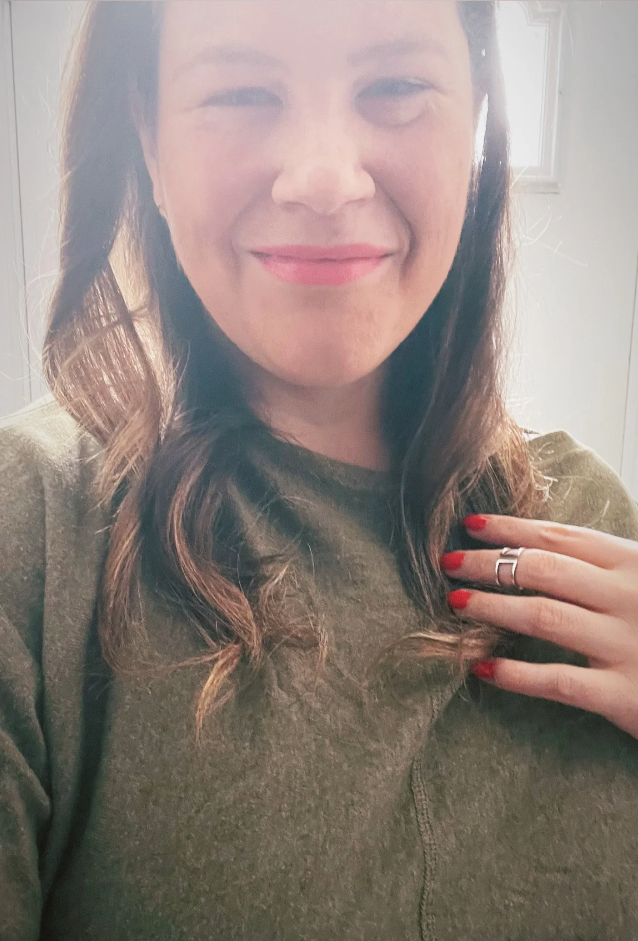 a photograph of Jill Harrison in front of a window