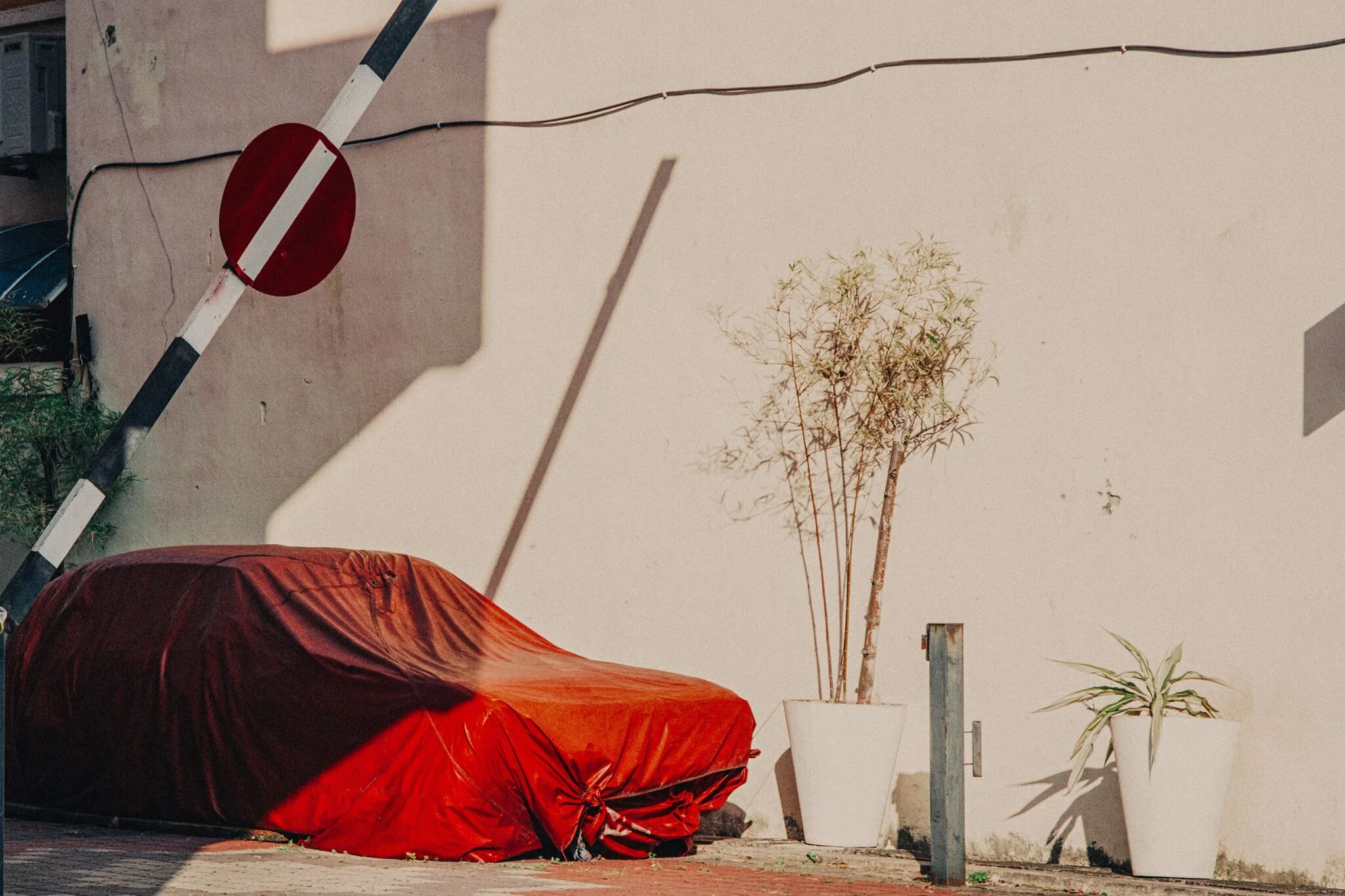 ANYWHERE BUT HERE Ongoing series exploring the disparity between the comfort and repetition of everyday life and the timeless drift of travel.