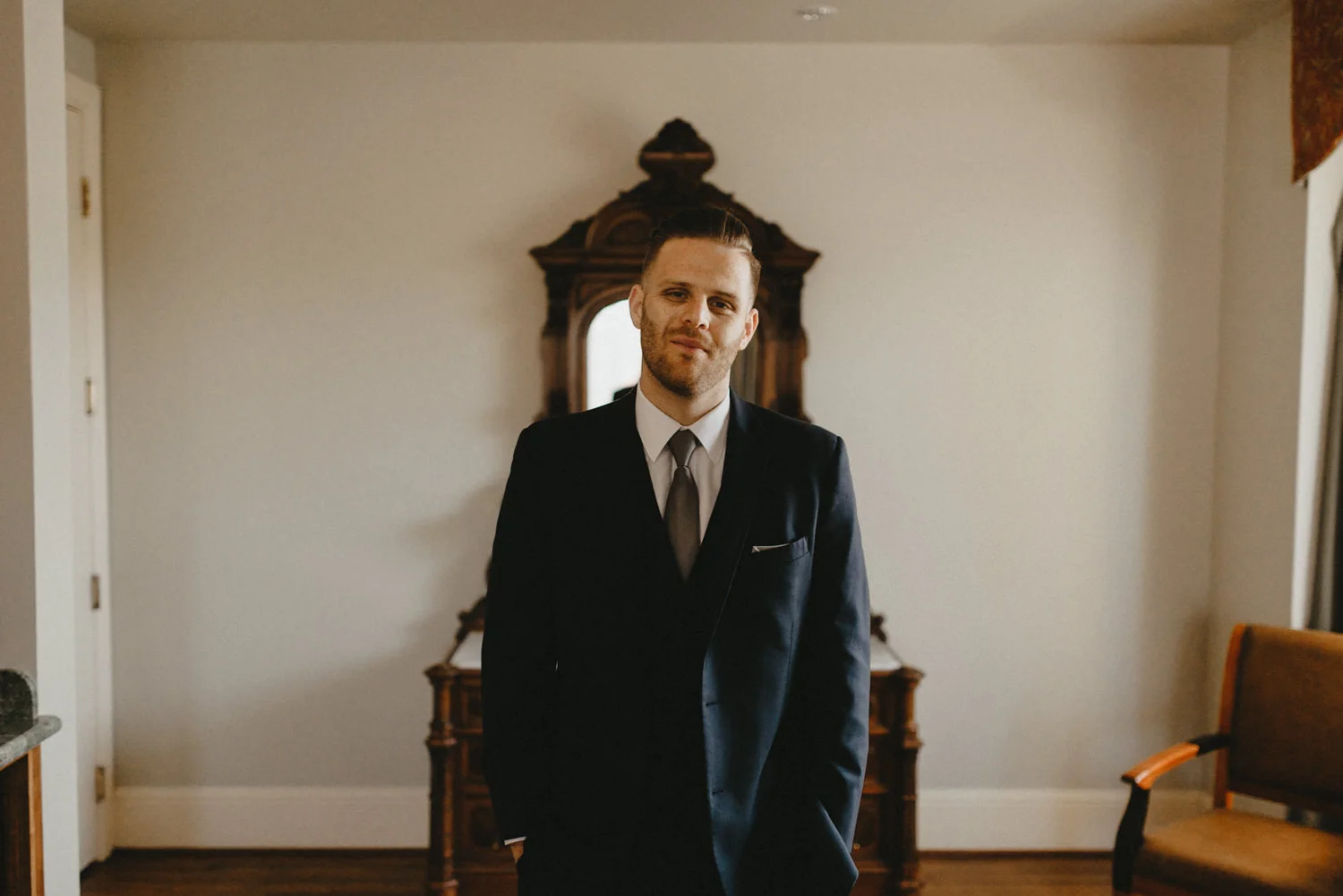 a portrait of a groom in a suite at hotel diamond