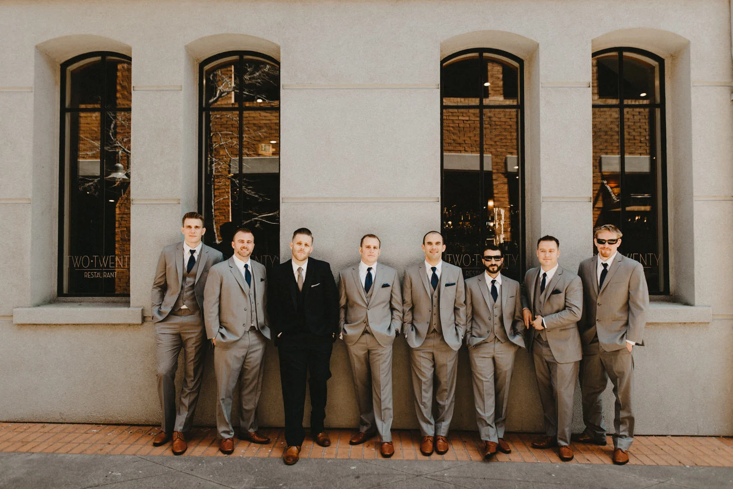 a group of men stare at the camera
