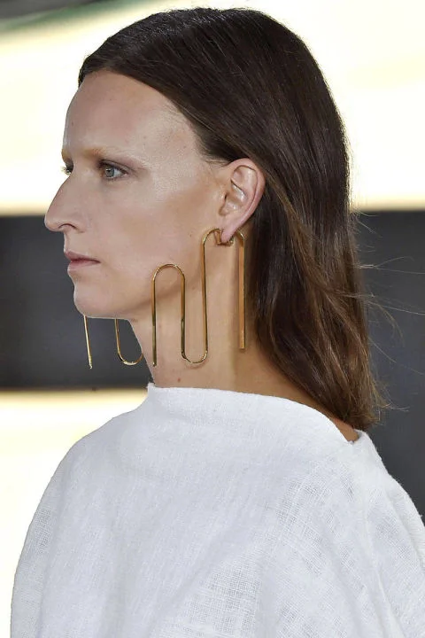 Brass sculptural earrings from Loewe, courtesy of Harper's Bazaar: http://www.harpersbazaar.com/fashion/fashion-week/g4400/best-jewelry-trends-spring-2015/?slide=8