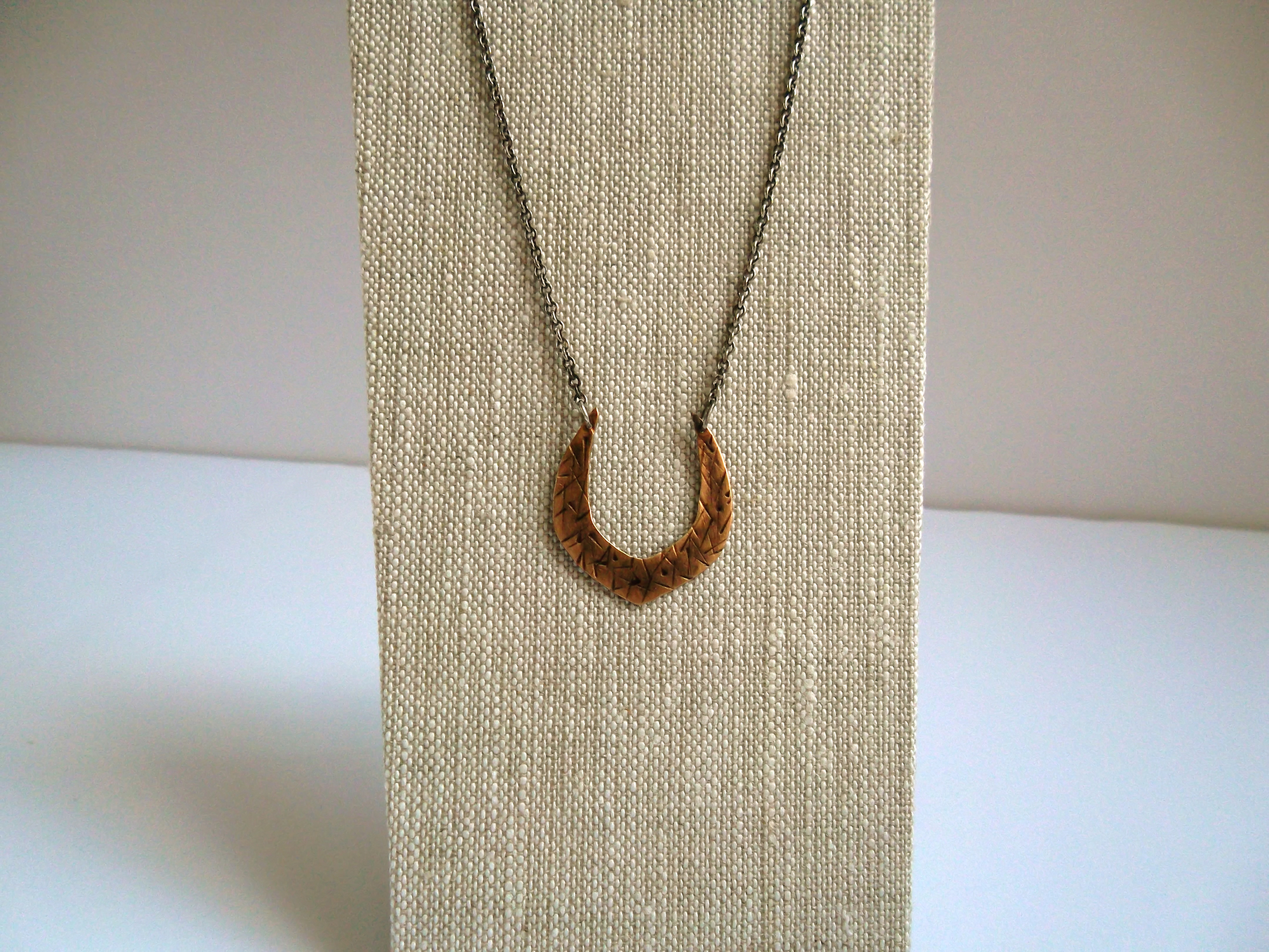 Blackened bronze and sterling silver horseshoe necklace