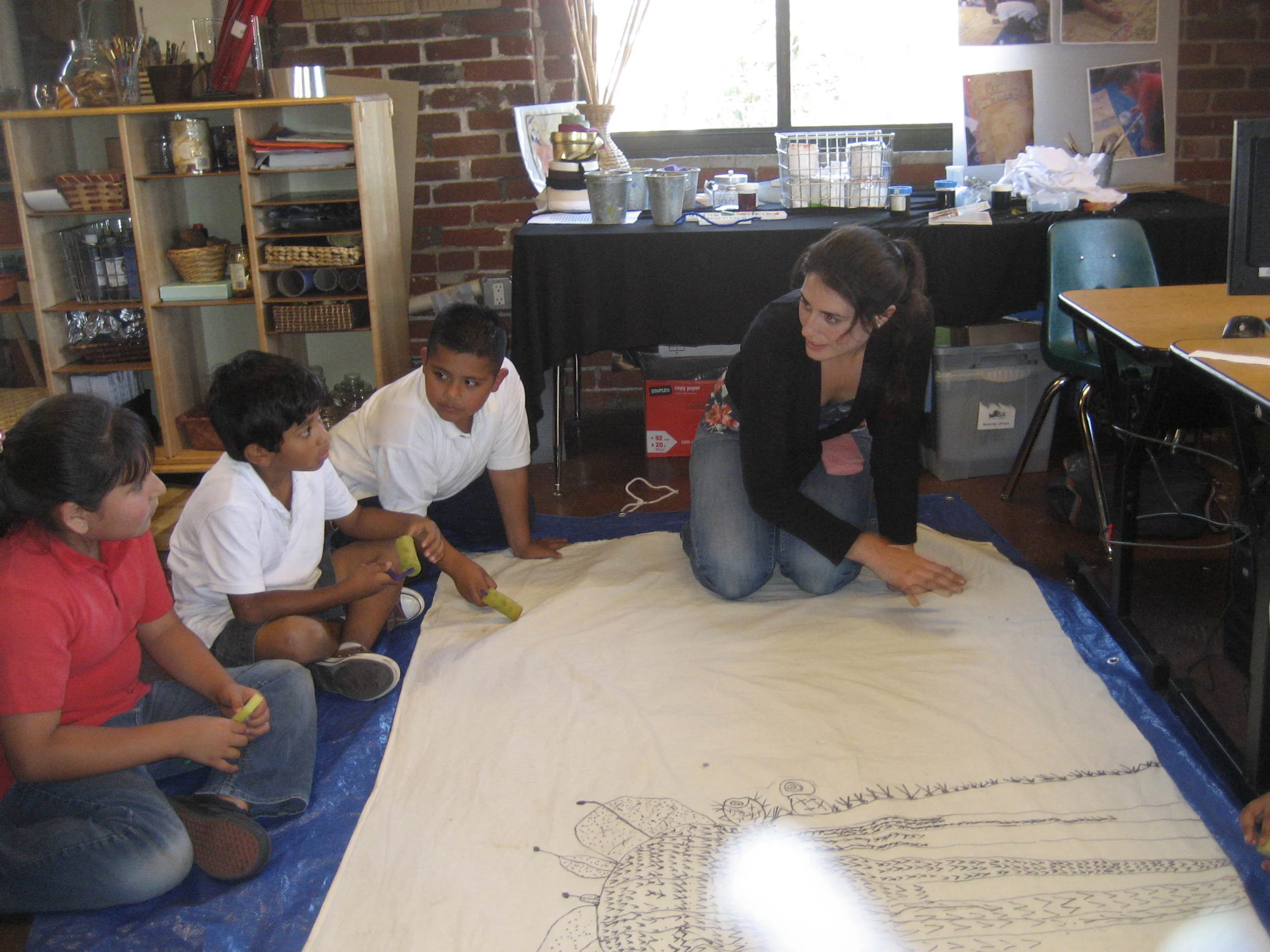 Working with a few students on a large Saguaro cactus mural. 