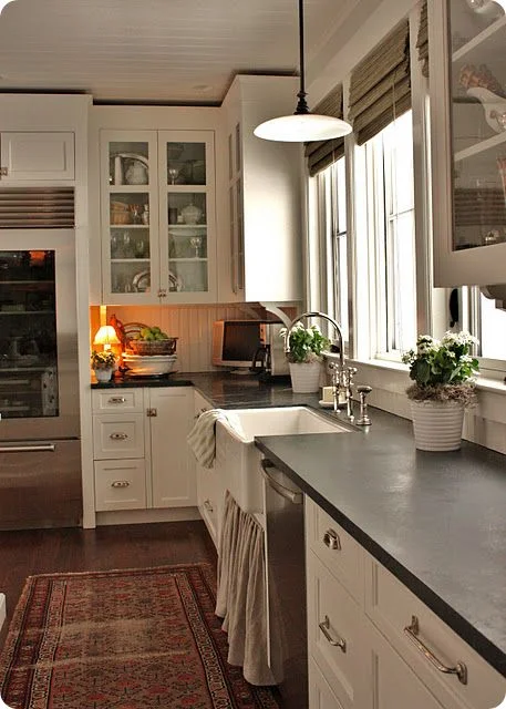 Encouragement! When we bought our house we didn't have too many options with countertops. We could have chosen a modern quartz or marble, but the upgrade charge was outrageous. One of the four granite choices was a deep dark green/emerald granite. Our kitchen doesn't get much natural light, but of all the choices it was definitely our favorite. Kitchens like the above reaffirmed that dark countertops don't have to make your space small and dark, but can actually create a cozy feel. 