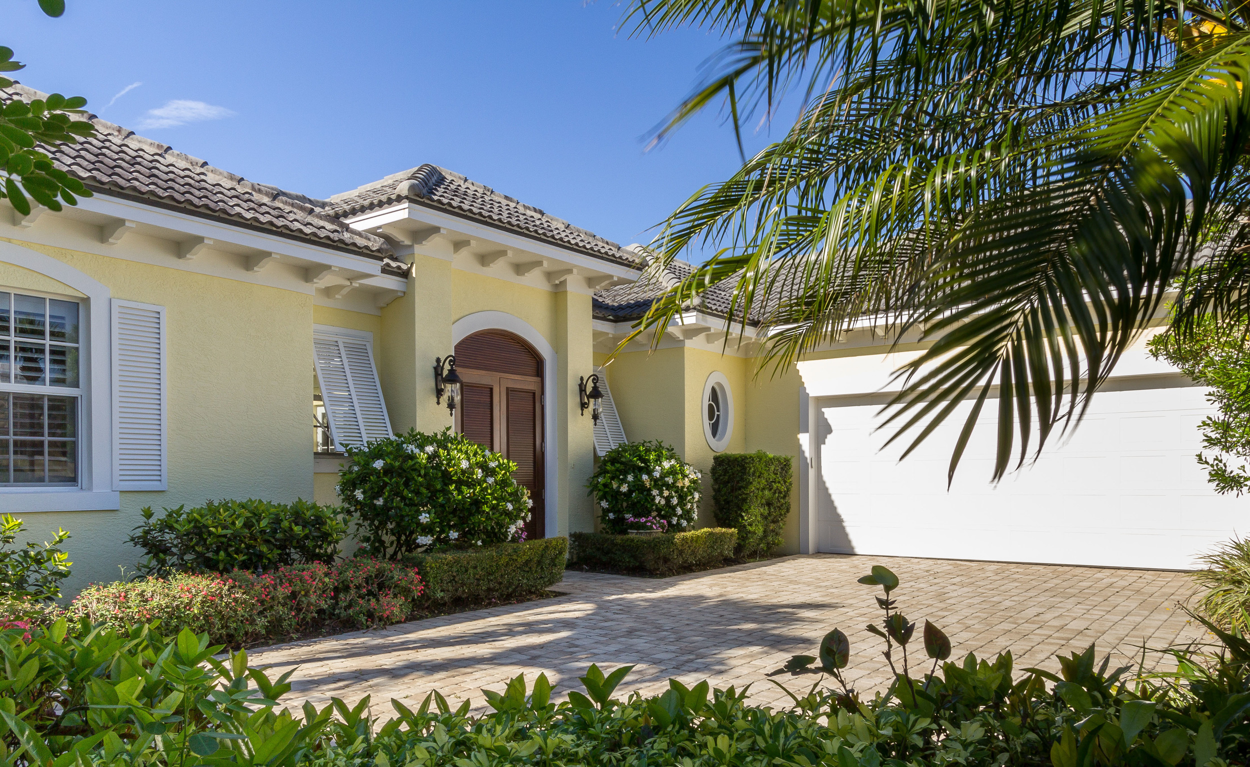 A front exterior photo of a Caribbean style home 