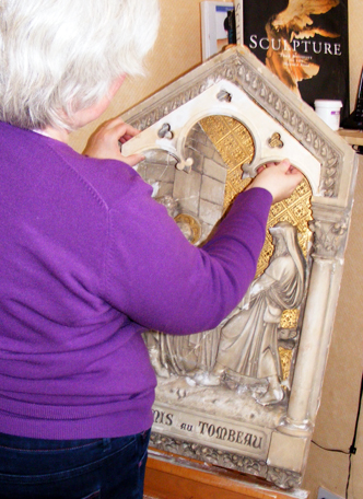 Repairing the broken plaster " station of the cross " for Upton Catholic  Girls School, Wirral, England.  
