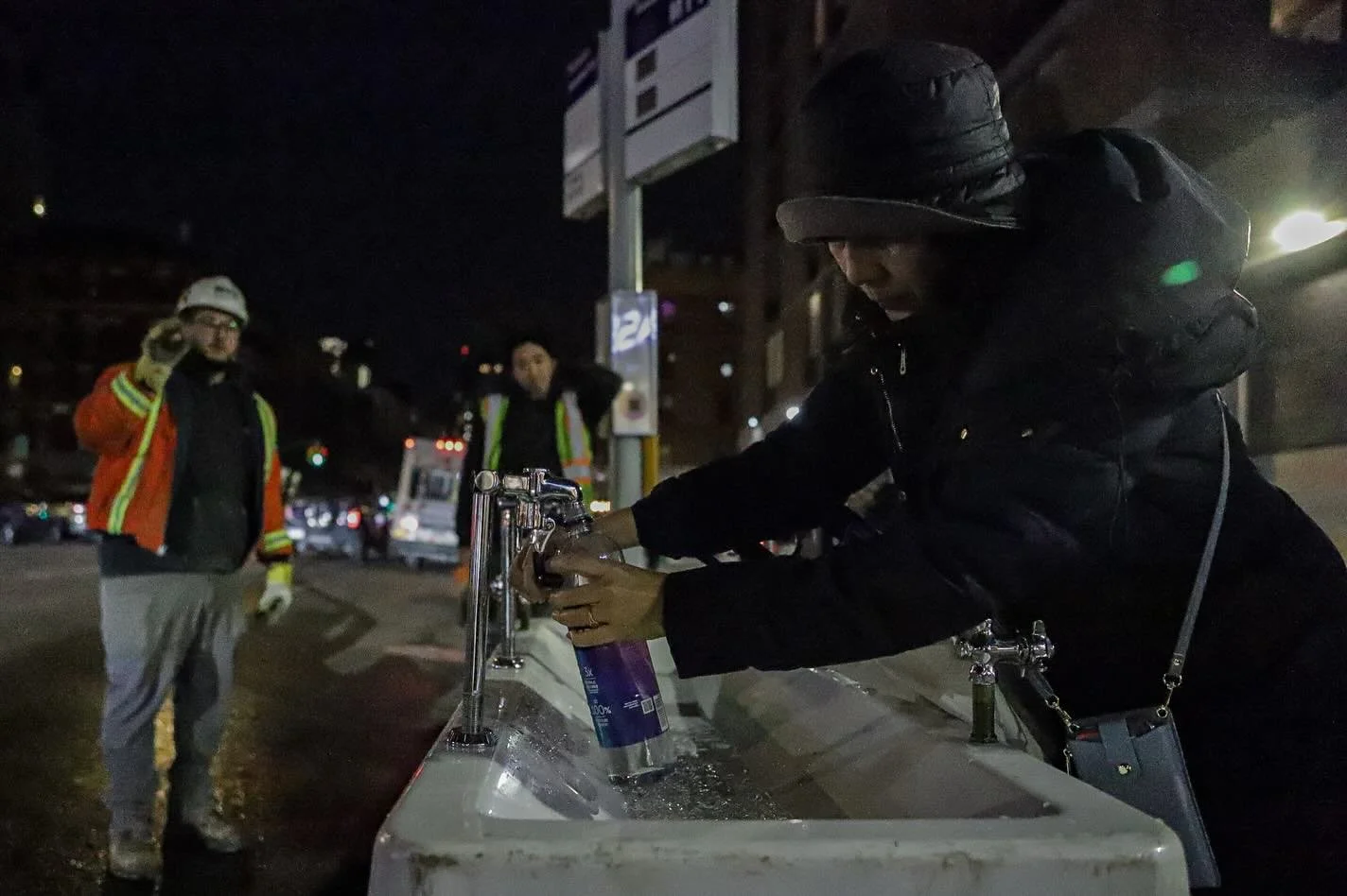 A lot of action on my block tonight: There was a water main break and our complex was without water all day. The city set up water stations outside the building and the local theaters opened their doors to let community use their bathrooms. I arrived