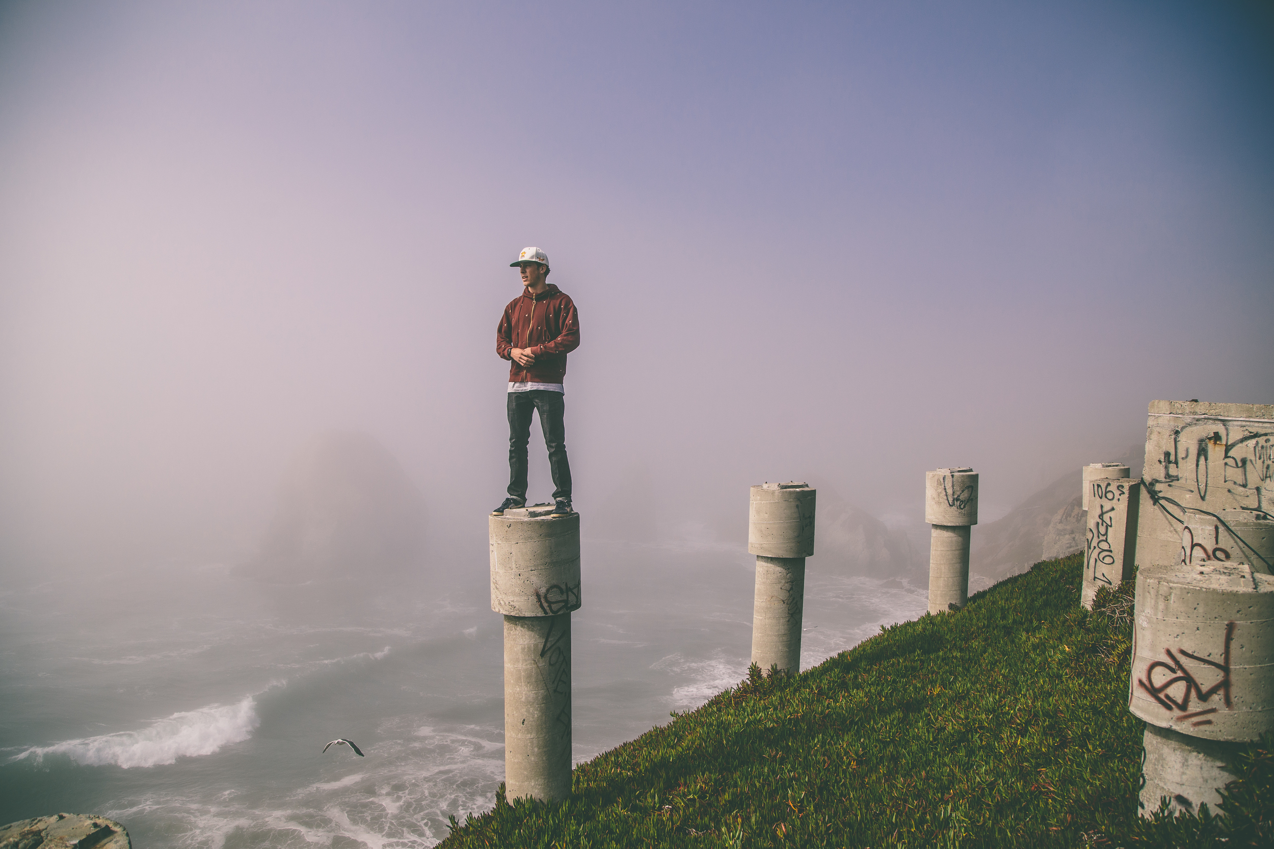 Kenny kickin it atop a concrete pillar..