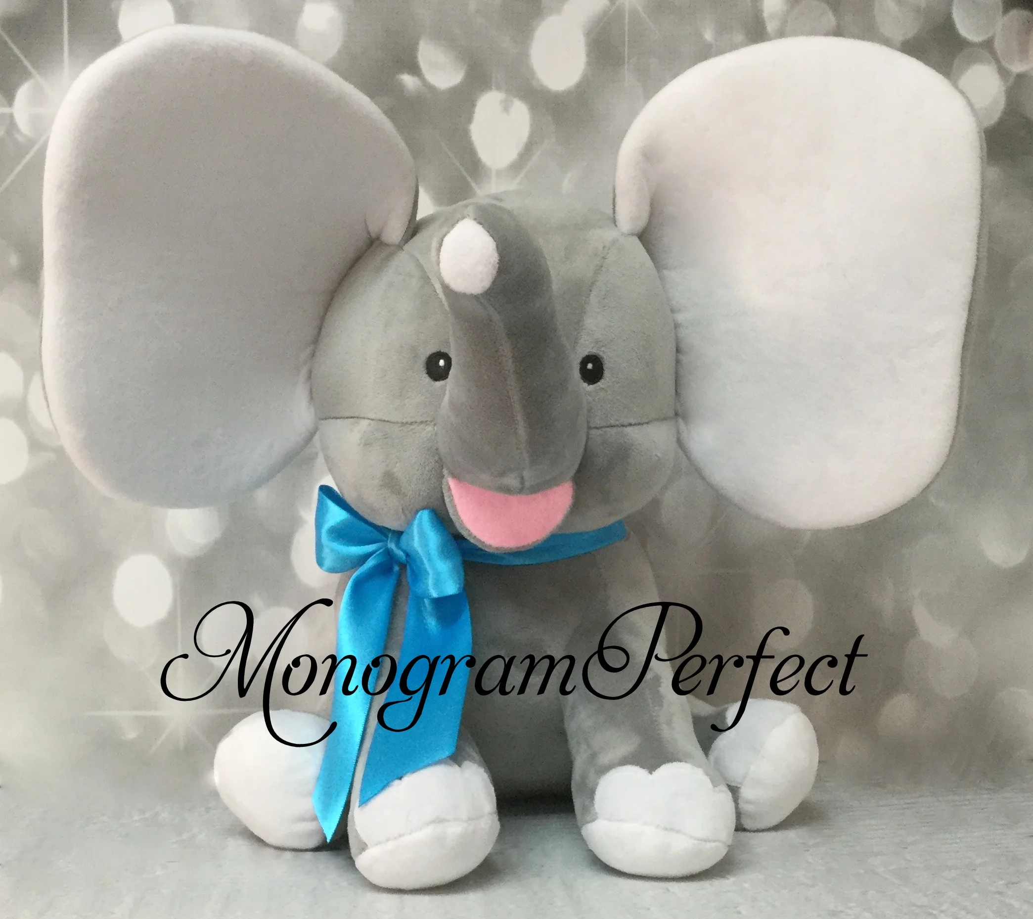 gray elephant with teal blue ribbon.JPG