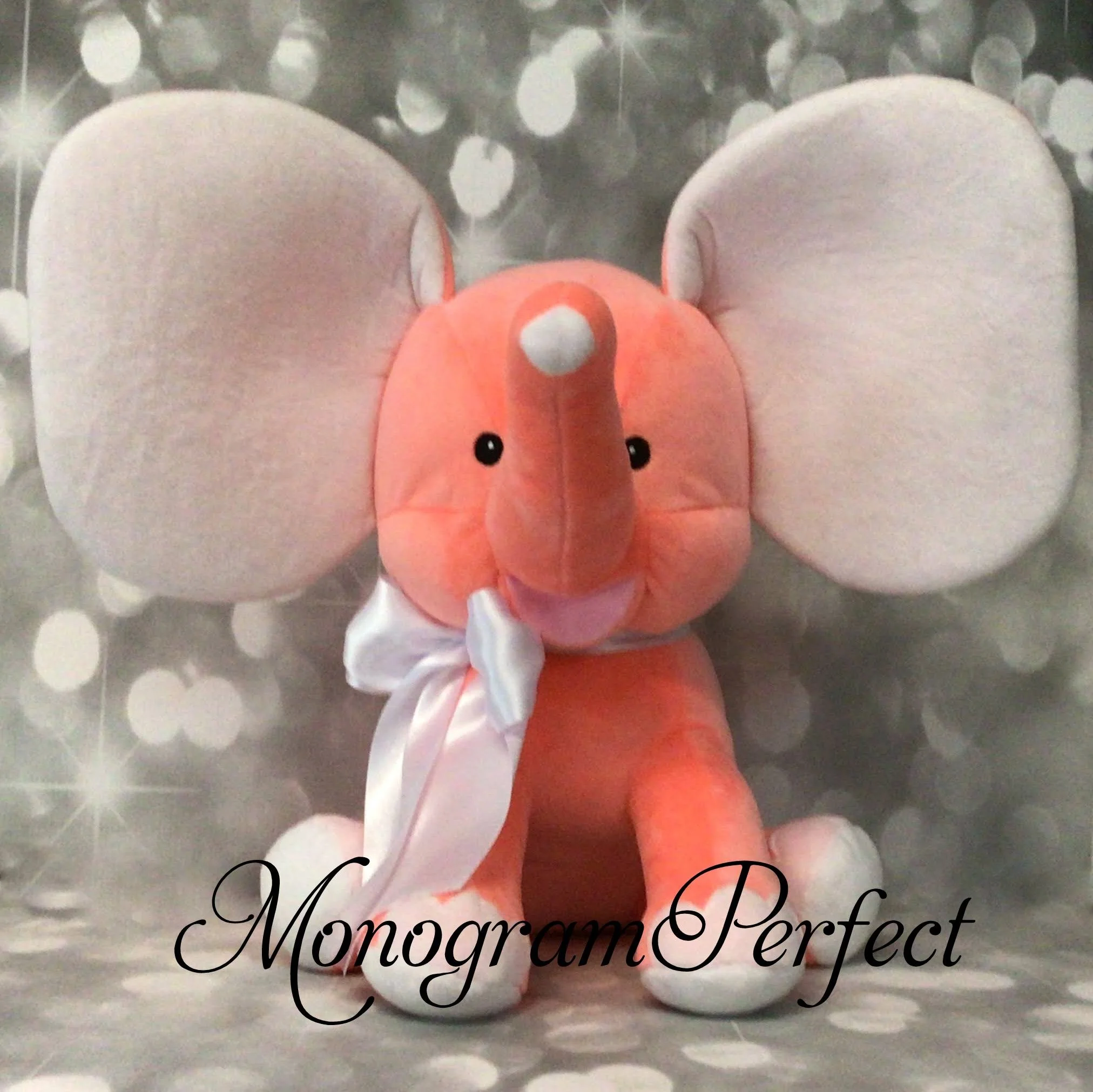 coral elephant with white ribbon.JPG