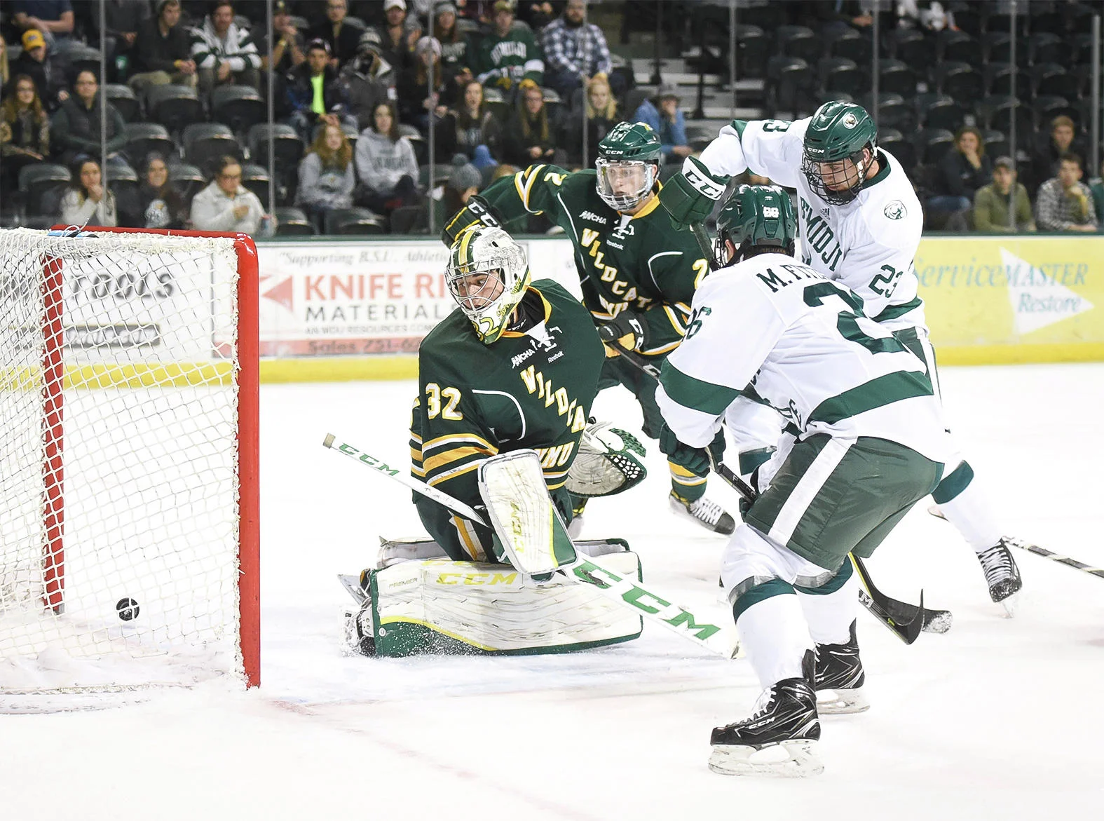 Bemidji State’s Myles Fitzgerald scores on Northern Michigan goalie Mathias Israelsson in December 2017.