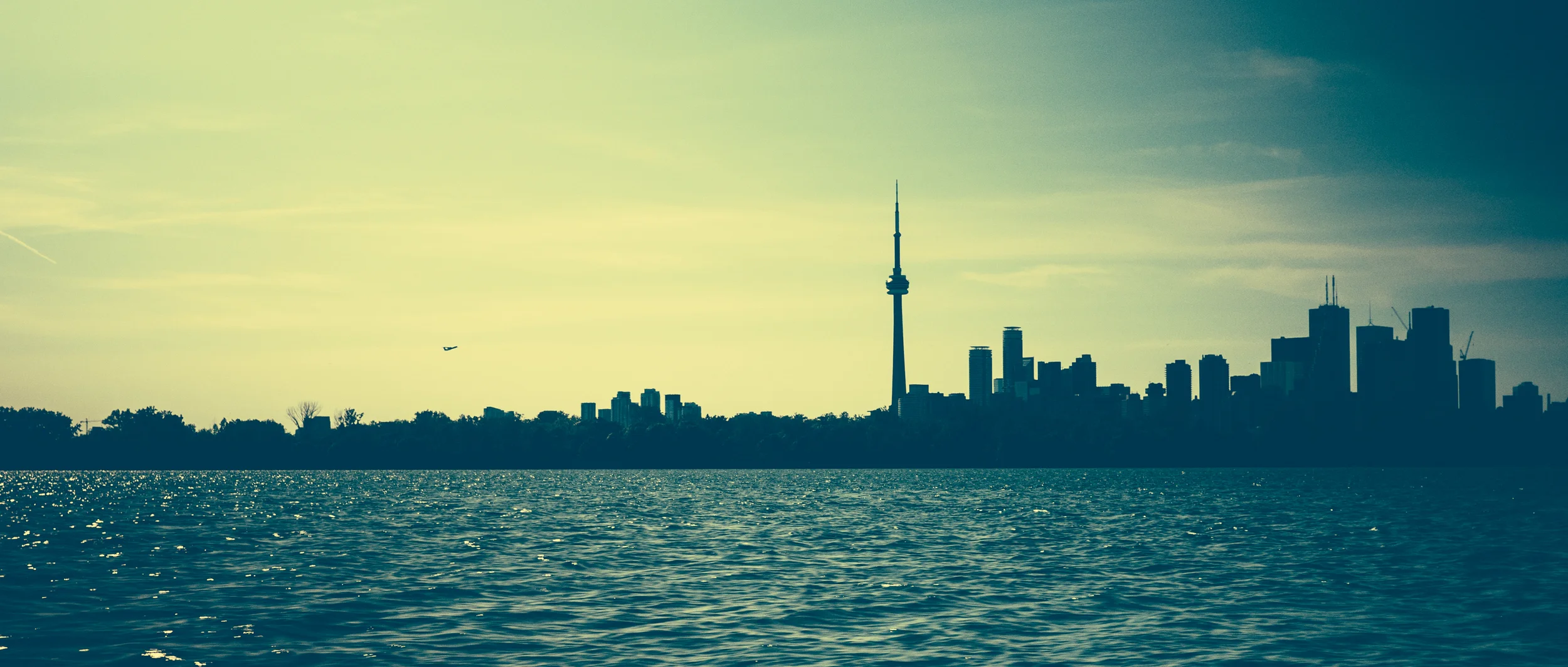 Toronto Skyline from Lake Ontario (with Porter planed ascending)