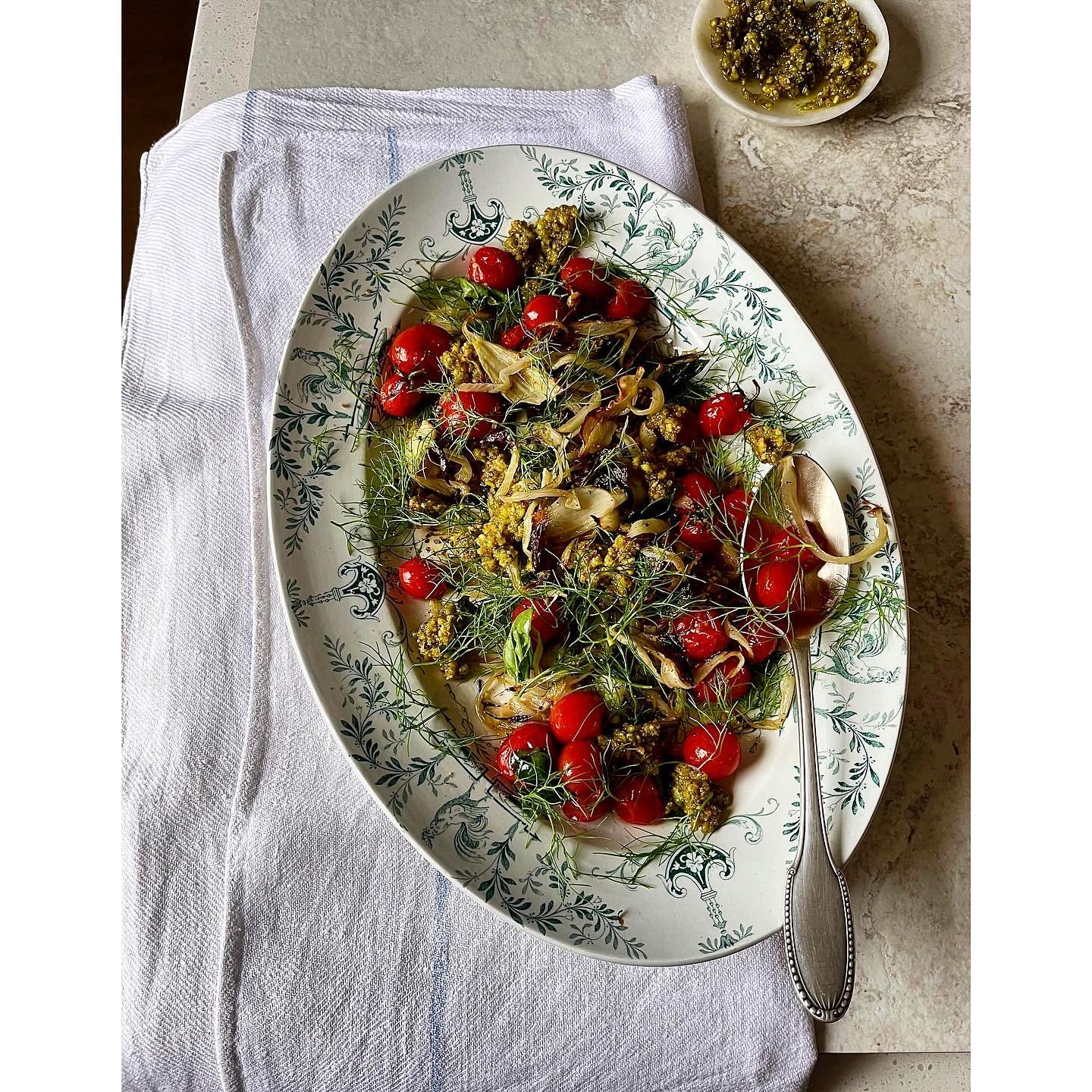 Roast fennel and sweet cherry tomatoes, served at room temperature with pistachio aillade. 
Fennel fronds and basil liberally scattered on top. 
So very good, leftovers to be tossed through pasta tonight, with a little tuna, anchovies and handfuls of