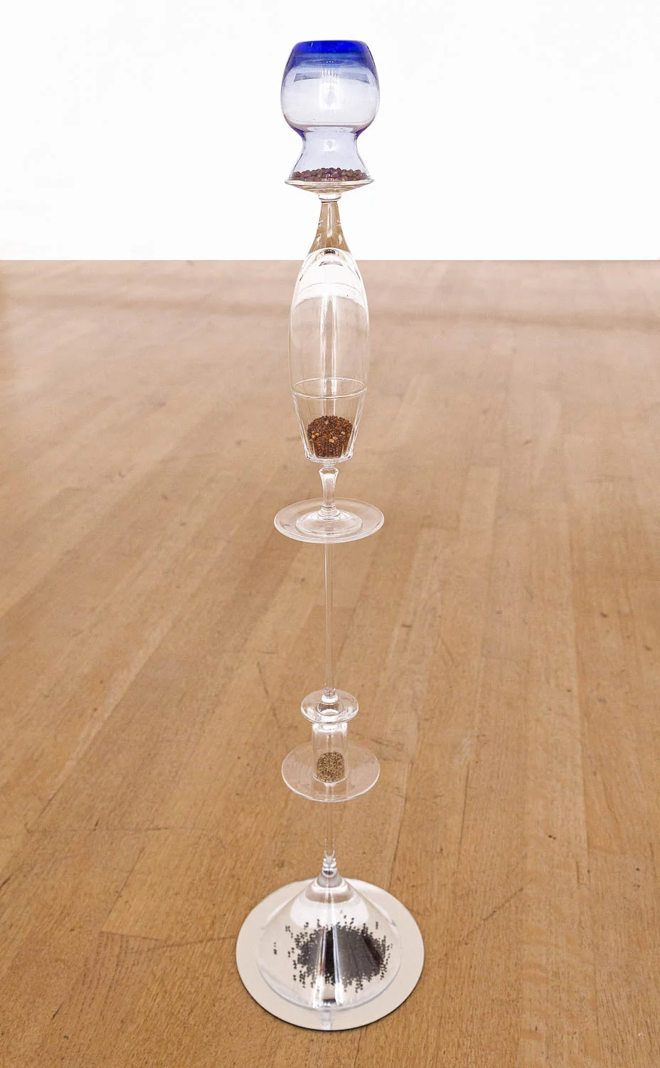 "Our glass: Bathroom", 2015, glass, various seeds, mirror, 28" x 5" x 5"