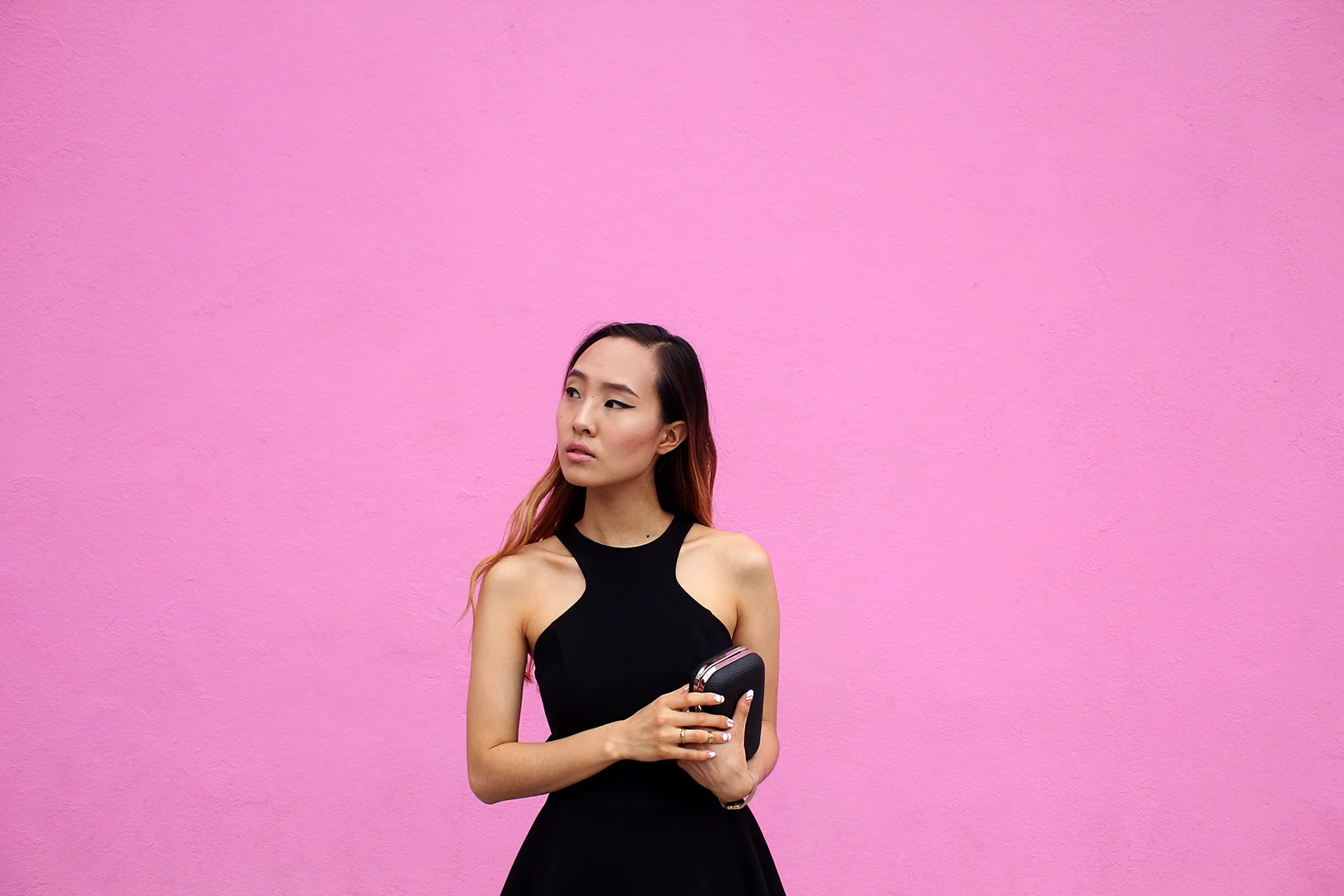 In front of the pink Paul Smith store. - Romper by Nasty Gal.