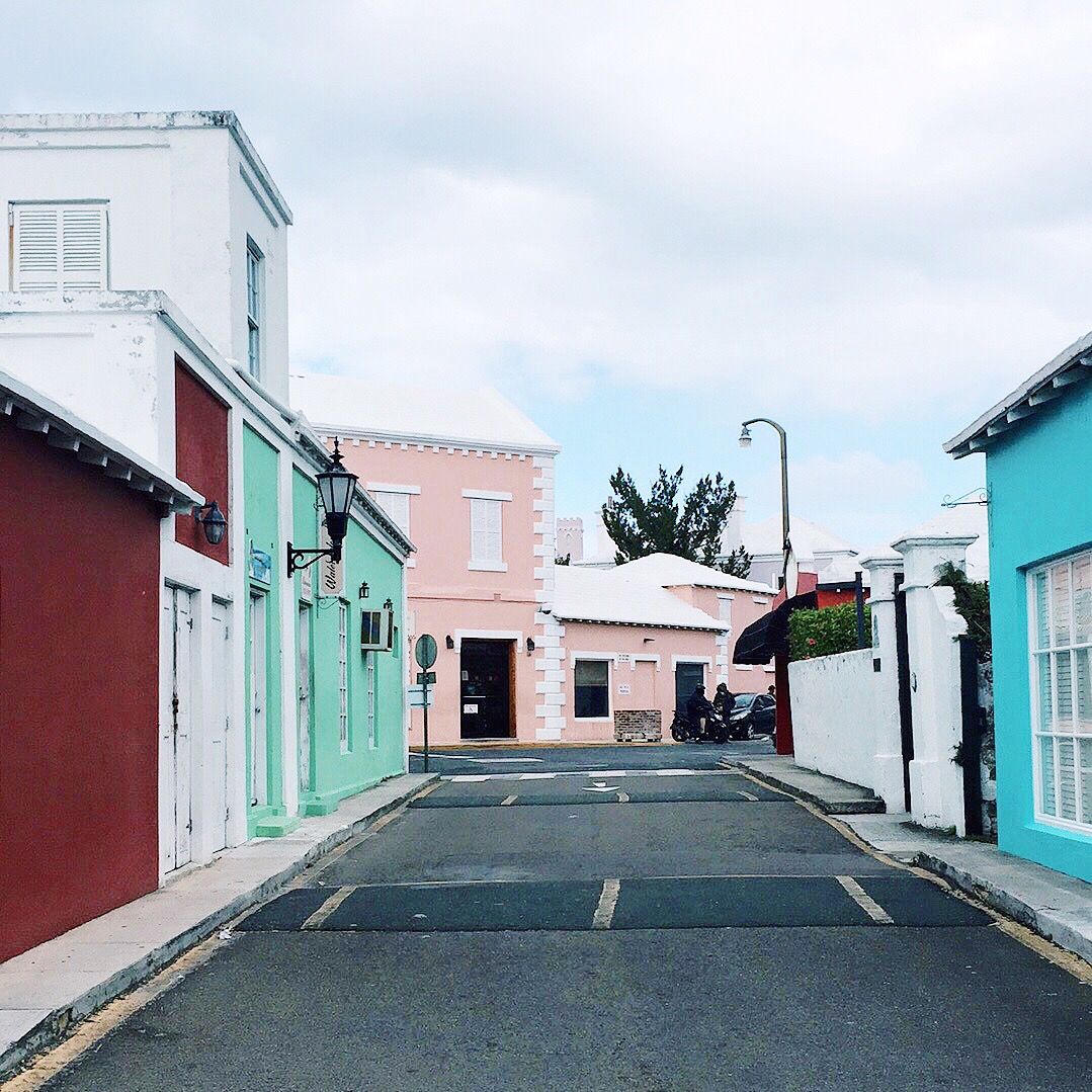  Colonial style pastel buildings around central King's Square in St. Georges. 