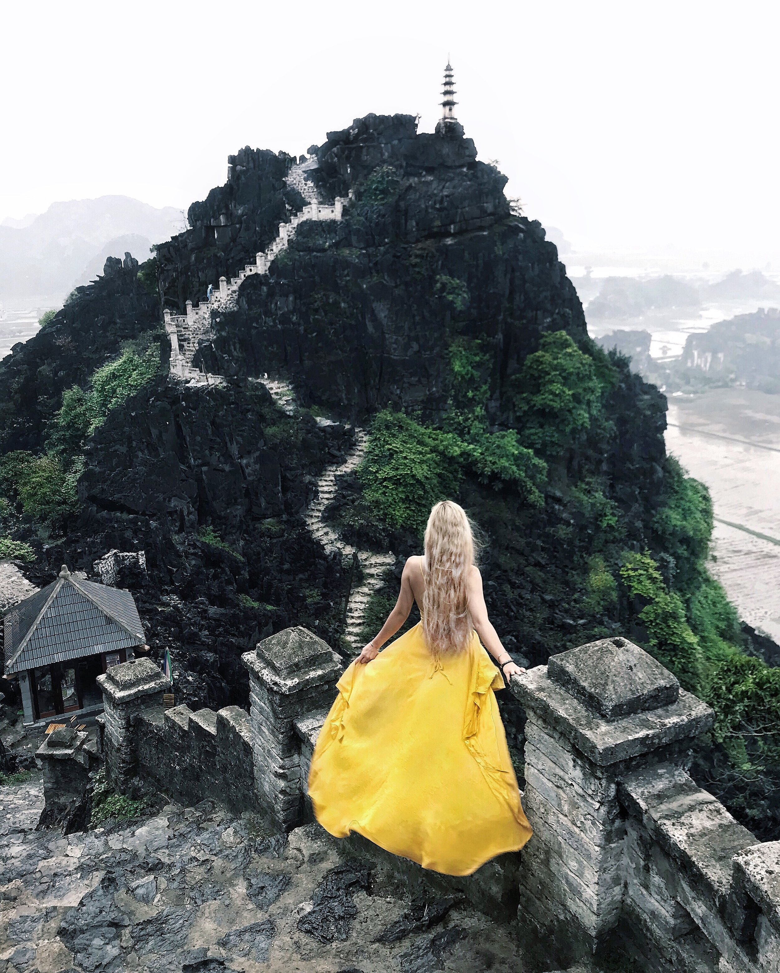  ENJOYING THE INCREDIBLE VIEWS OF THE HANG MUA STEPS UP TO THE PAGODA 