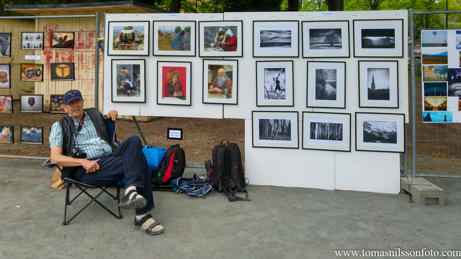 My dad in front of his six frames from the Viking Market on the left, my nine black and white frames on the right