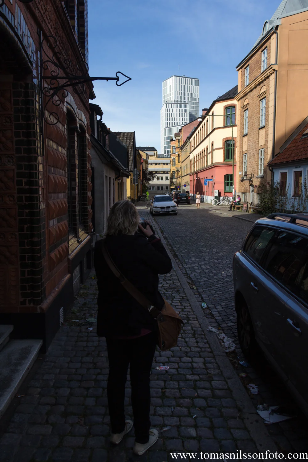 Susanne lining up a shot of Malmö Live.