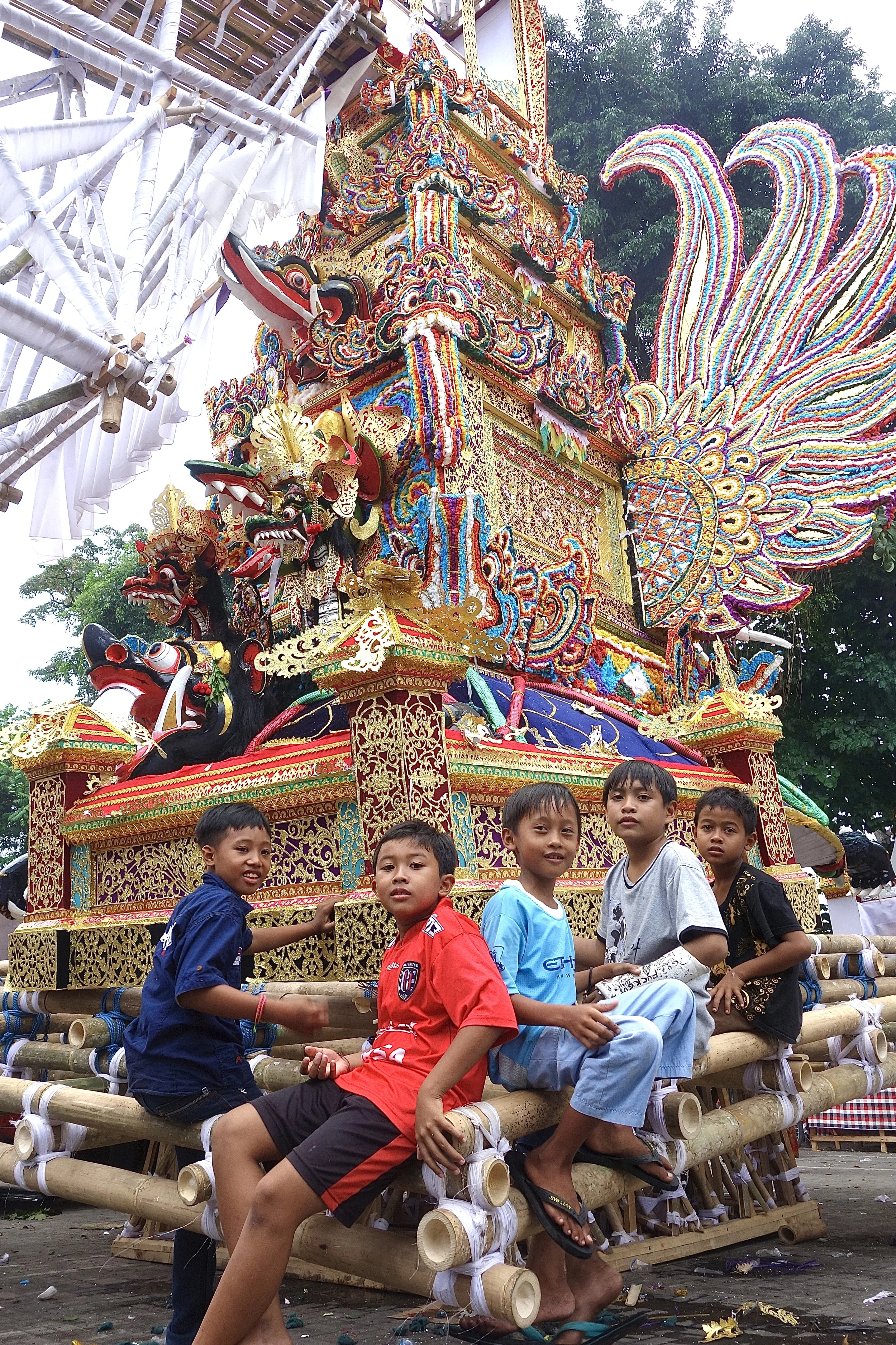 BALINESE BOYS ON A PELEBON CREMATION TOWER