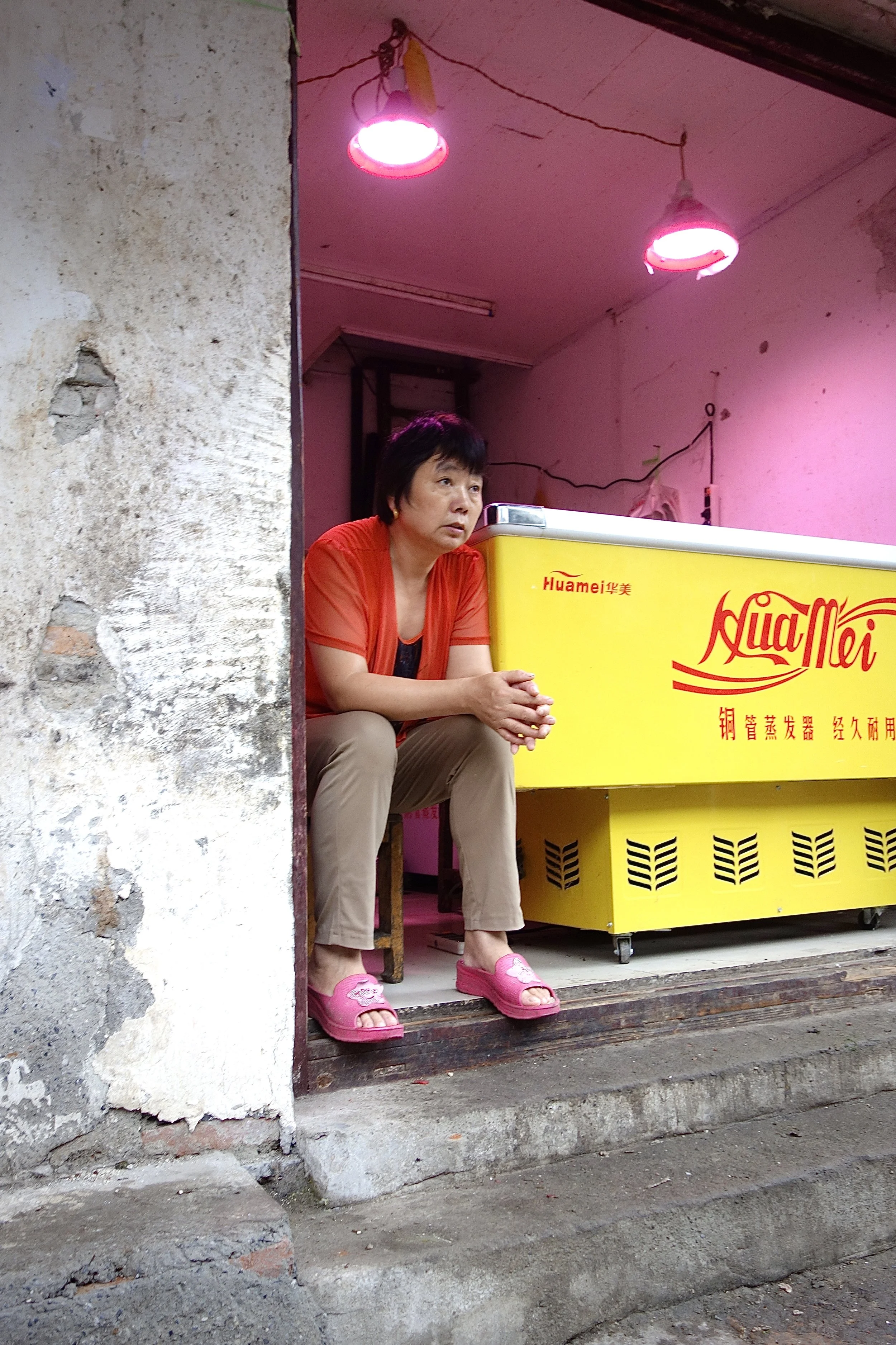 MEAT SALESWOMAN WITH PINK SHOES