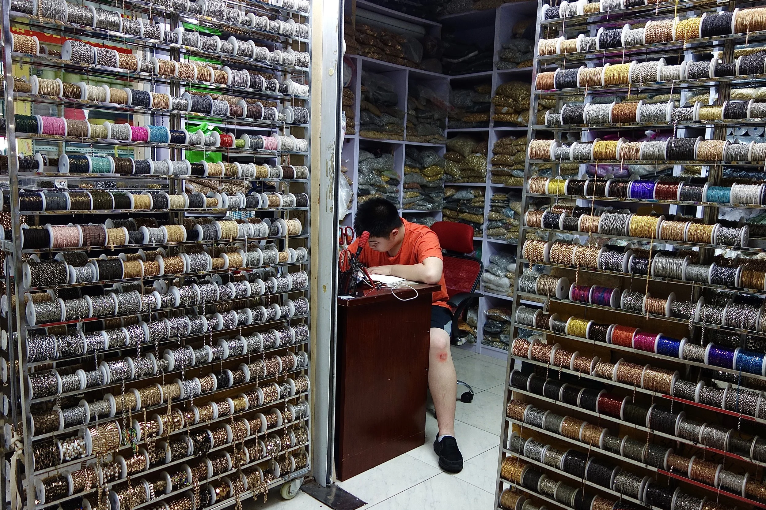 BOY WORKING IN A CHAIN SHOP