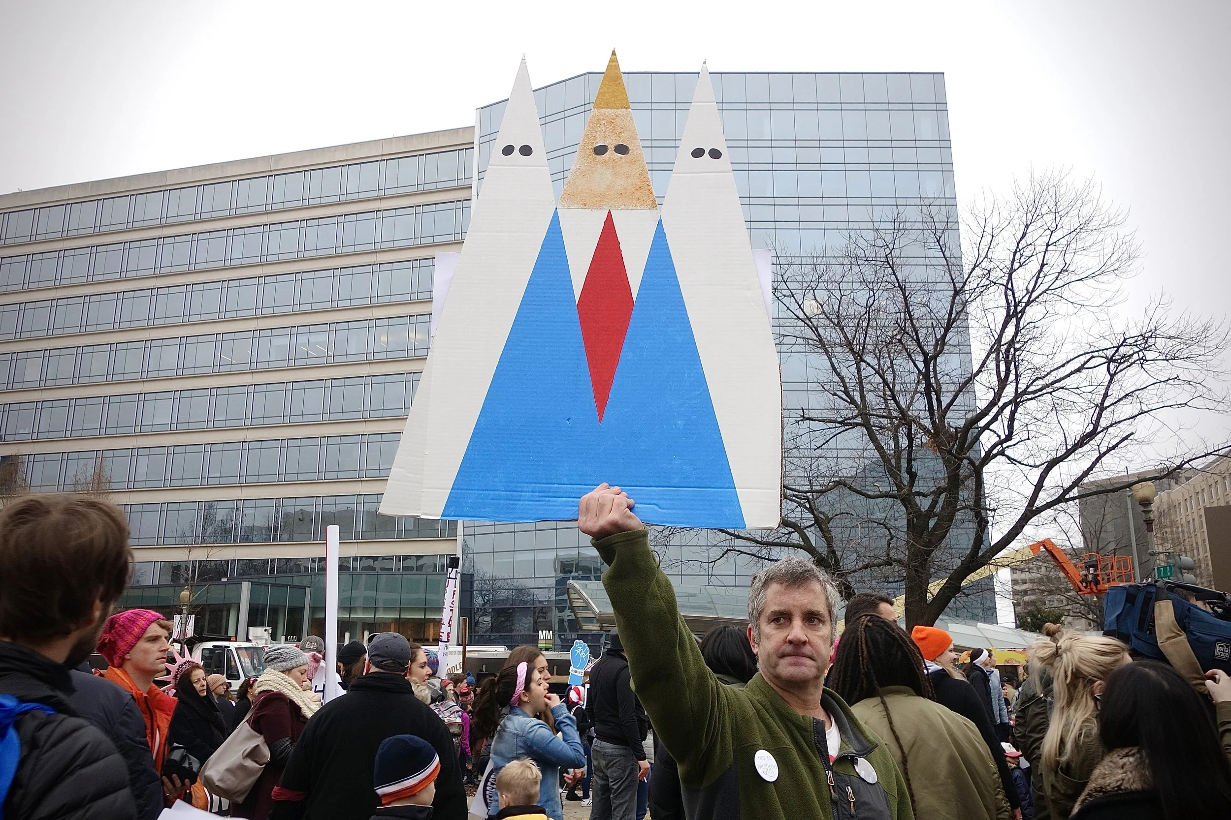 SIGN WITH THREE WHITE HOODS