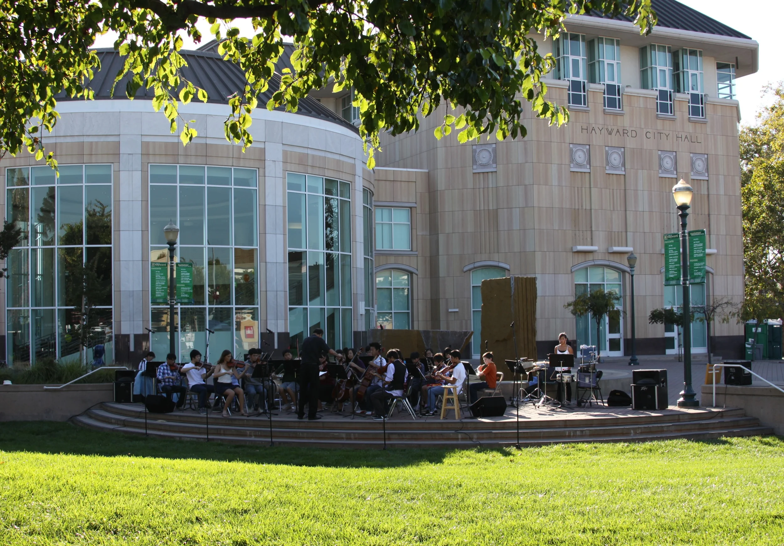 East Bay Youth Orchestra (EBYO) performs outdoors at Hayward City Hall. Hayward, California.