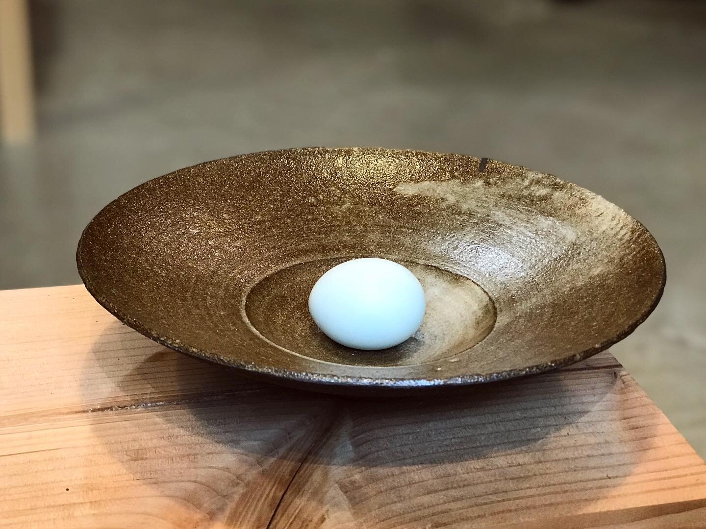 Bowl with blue egg
.
This silky mat glaze, turns this black clay warm and brown.
Black is never just black. It&rsquo;s made up of a mix of green, blue and brown oxides and when glazing it, the true nature of the black comes out.
In this case the blac