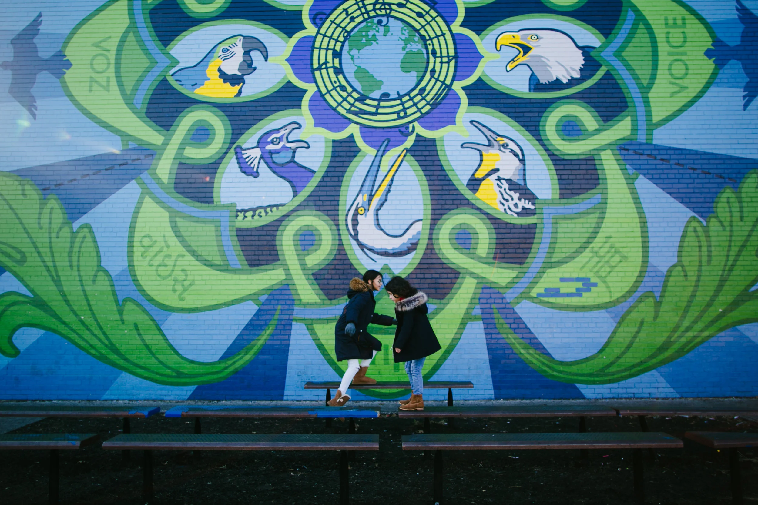 Mural 3/100 - We found a school covered in murals and there was a playground as well. The girls really enjoyed it.