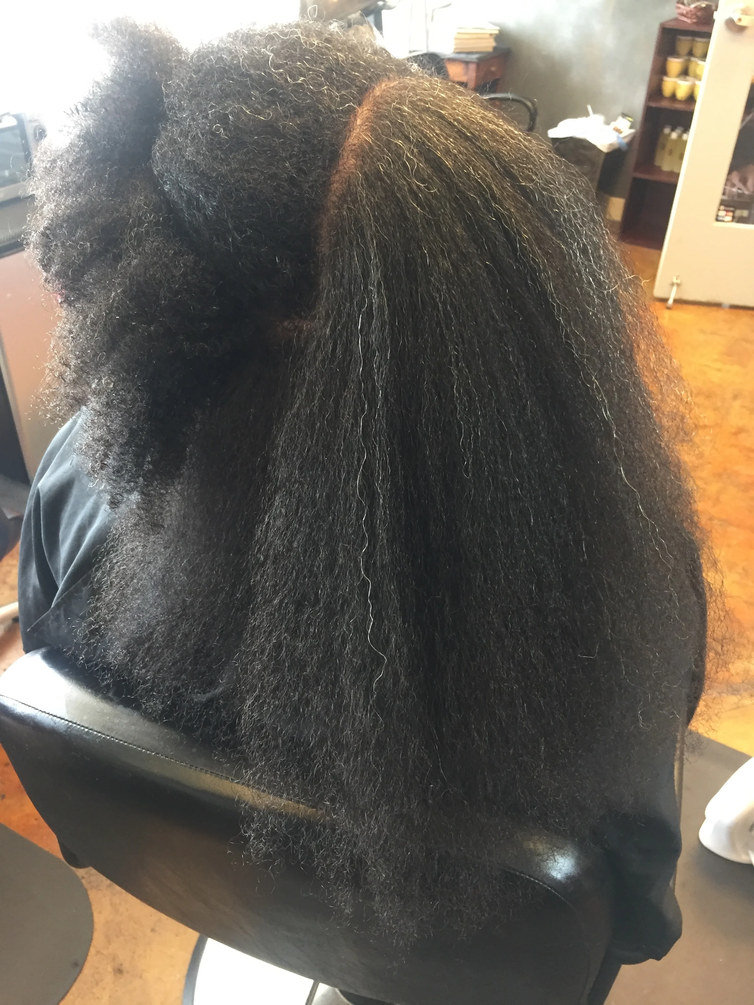  DURING: Blow dry showing impact of shrinkage on natural hair 
