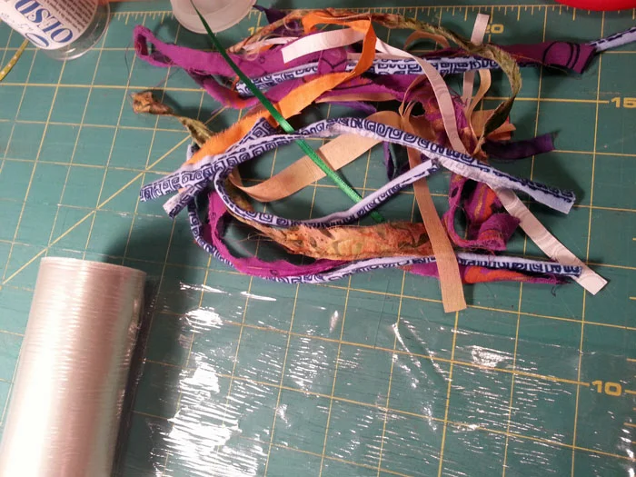 I cut the fabric into strips and laid them out on water soluble stabilizer.