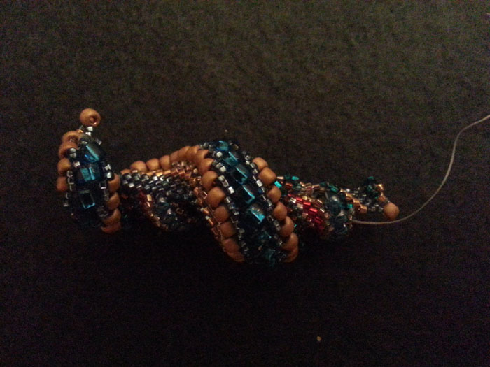 Third attempt! This one I finished in seven hours. The problem? It looks like a bejeweled appendix instead of the spiral seashell I was going for.