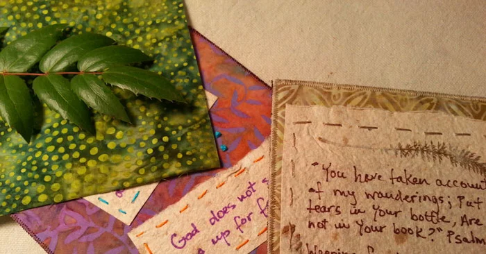 I also used some handmade paper fused and hand embroidered it to a fabric background. The weather isn't right for making paper right now, but I had some in my stash. These pieces were made with cotton lint, grasses and ferns.