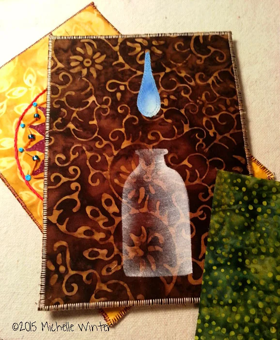 The yellow one behind is fused, stitched, hand embroidered and embellished with some size 6 beads and a button. The brown one is fused, stitched and oil painted. The green one is oil painted.and stitched.