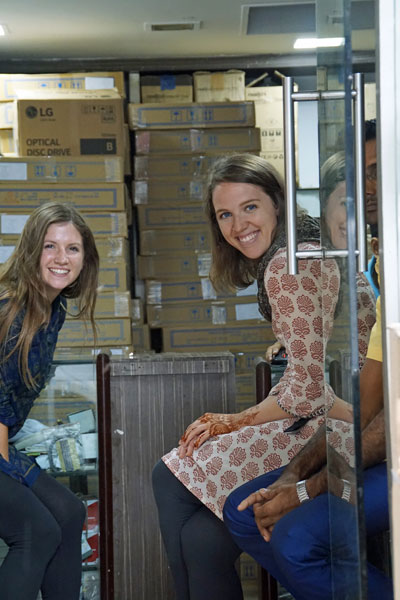 Halie and Abby, Girls of Grit and Determination at the computer store in Kolkata.