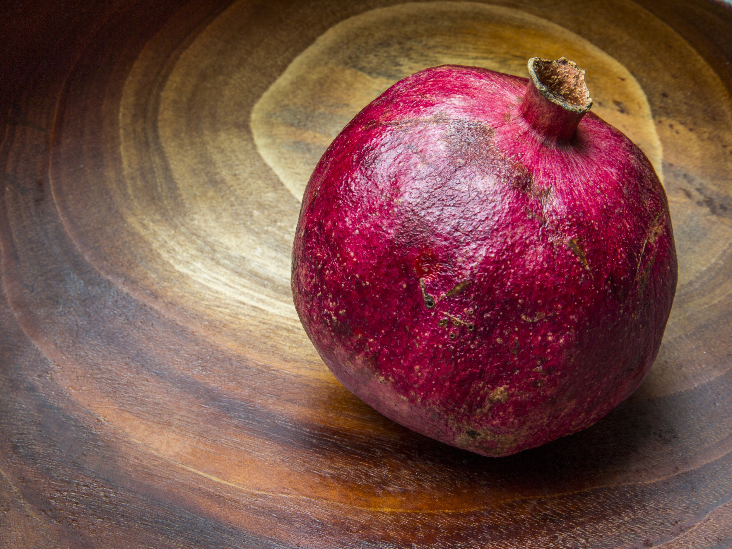 Pomegranate in Wooden Bowl