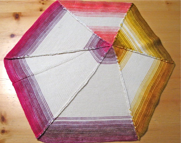 The approved sample for background fabric color and construction techniques to be applied for the full size floor sculpture.