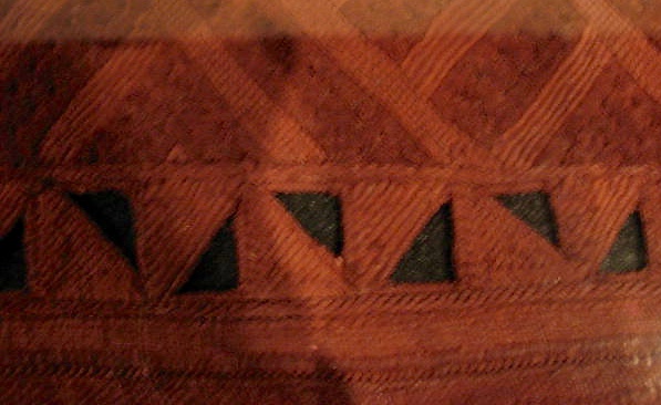 An exellent example of cutwork, embroidery, both pile and surface, and dye. 
